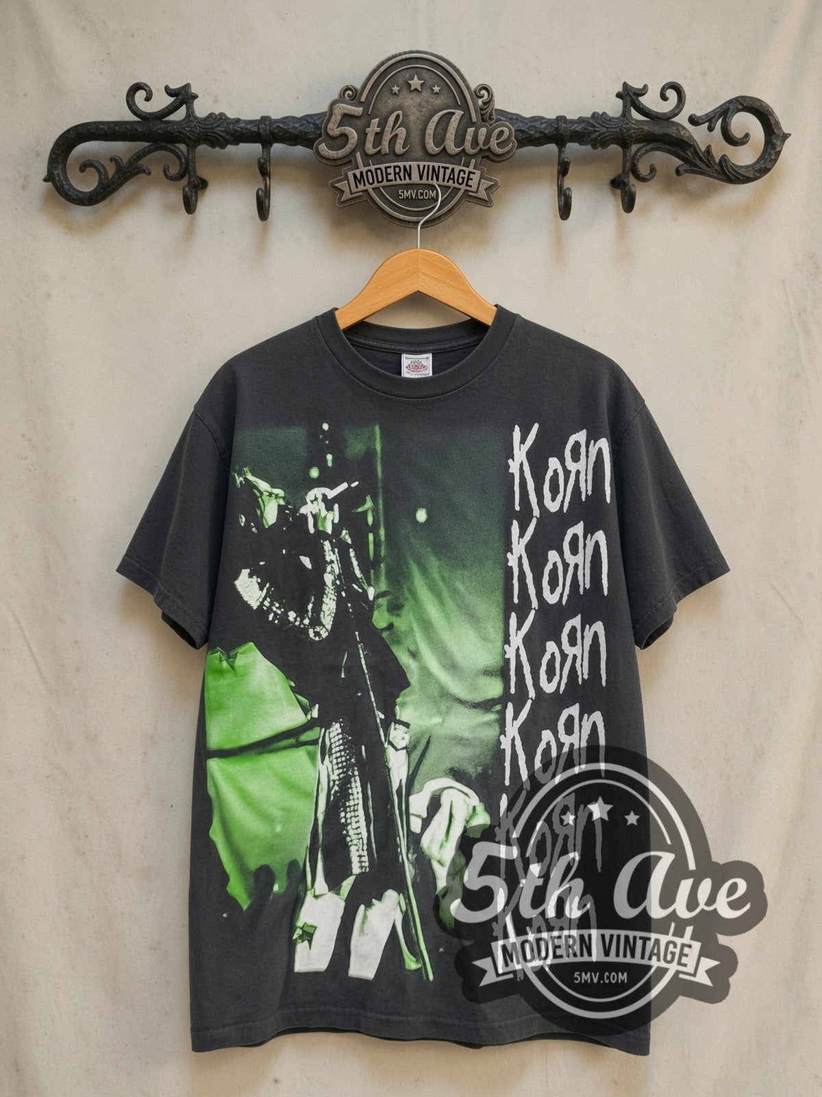 Korn Falling Away from Me vintage band t-shirt in black, front view on a display rack