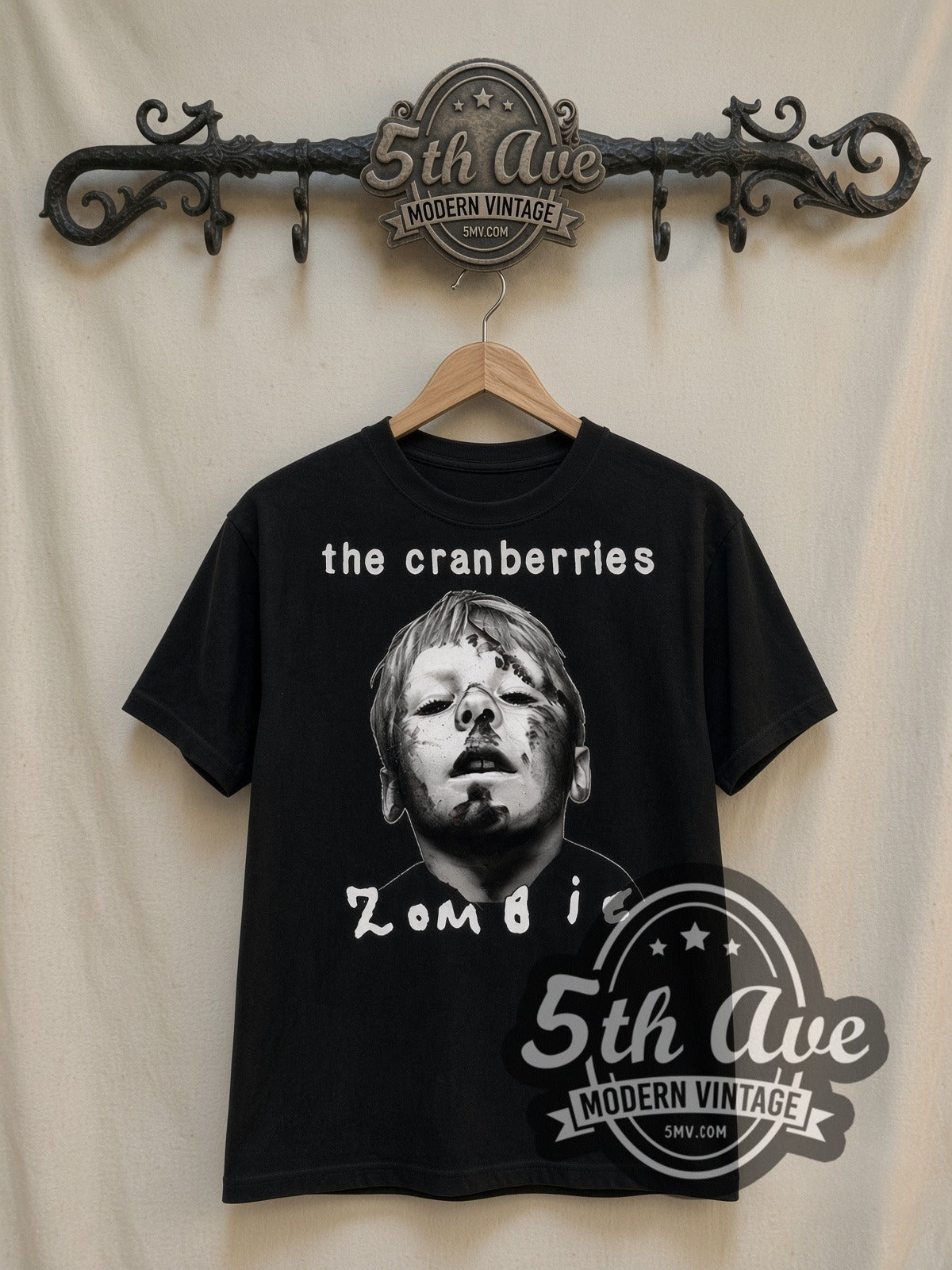 The Cranberries Zombie vintage band t-shirt in black, front view on a display rack