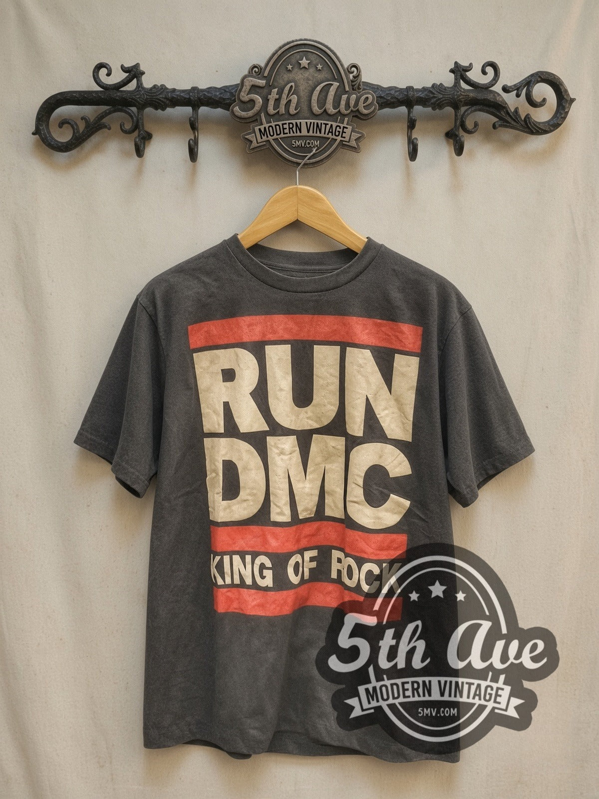 RUN DMC vintage rap tee, front view on a display rack