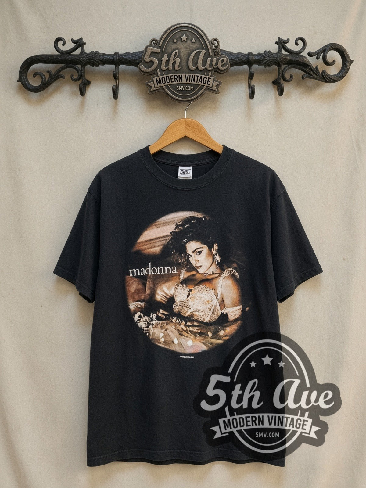 Madonna The Virgin Tour' 1985 vintage band t-shirt in black, front view on a display rack