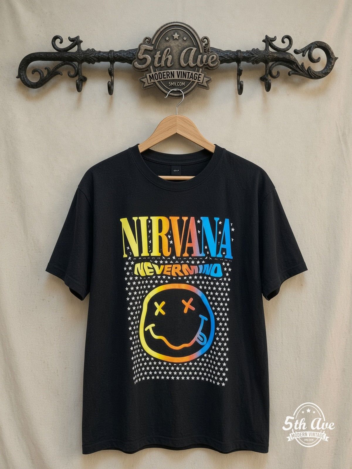 Nirvana – Nevermind Rainbow Smiley Stars – Vintage Band T-Shirt — front on locked cream ornate 5th Ave rack