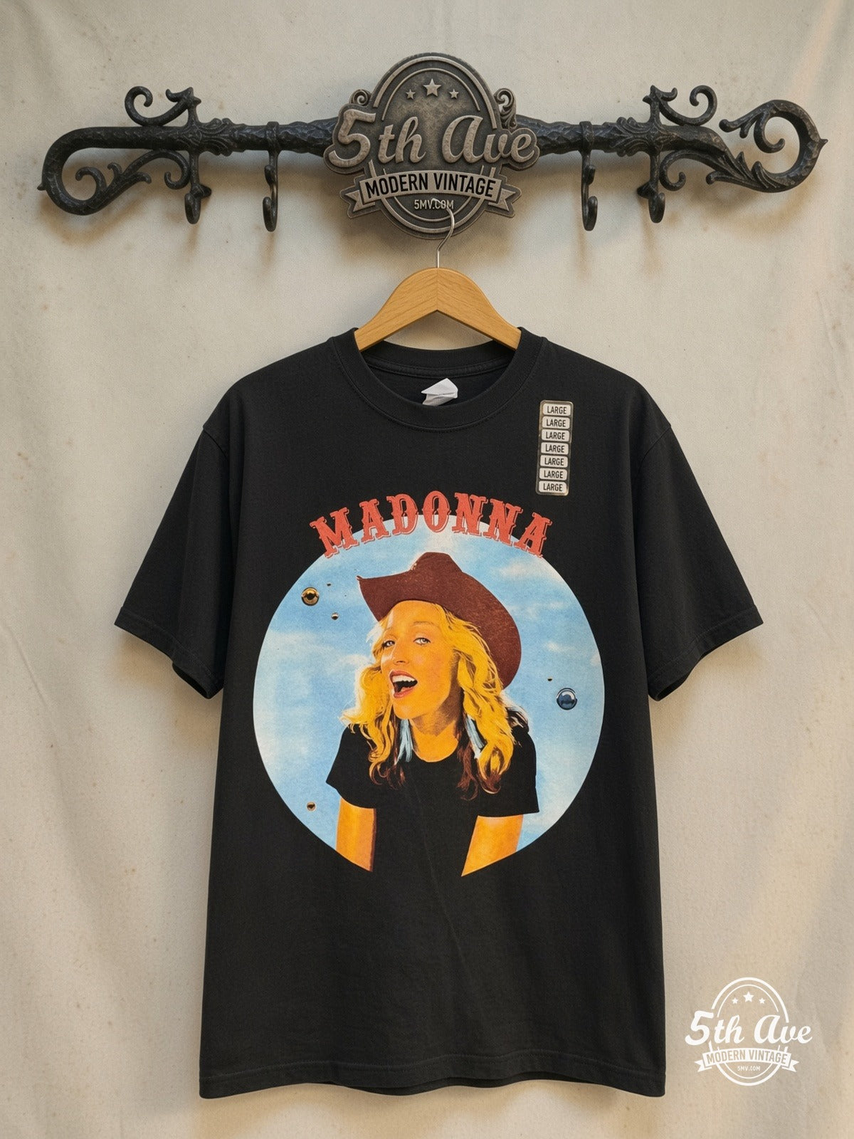 Madonna – Brixton Academy Concert 2000 – Vintage Band T-Shirt — front on locked cream ornate 5th Ave rack