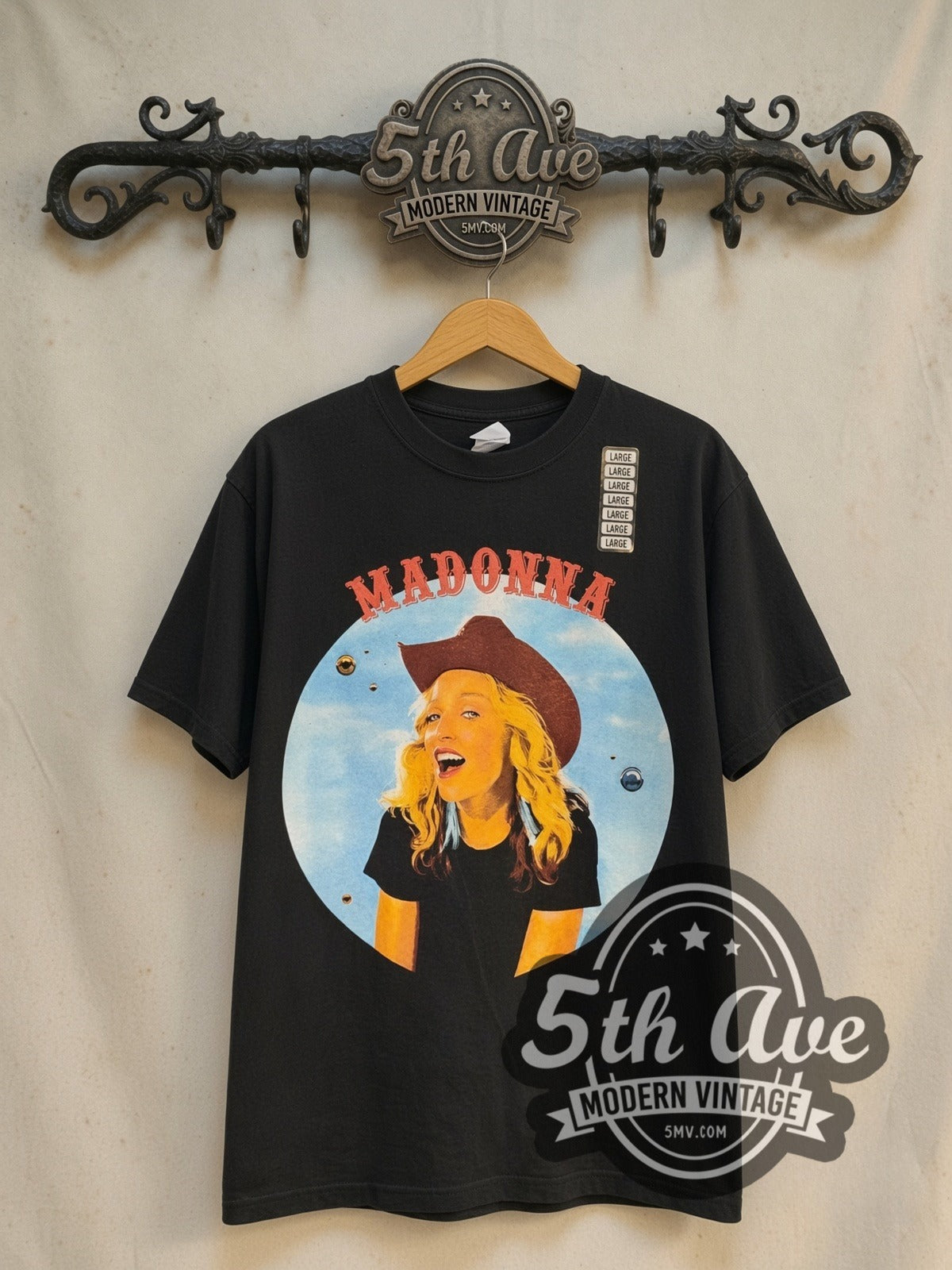 Madonna Brixton Academy Concert 2000 vintage band t-shirt in black, front view on a display rack