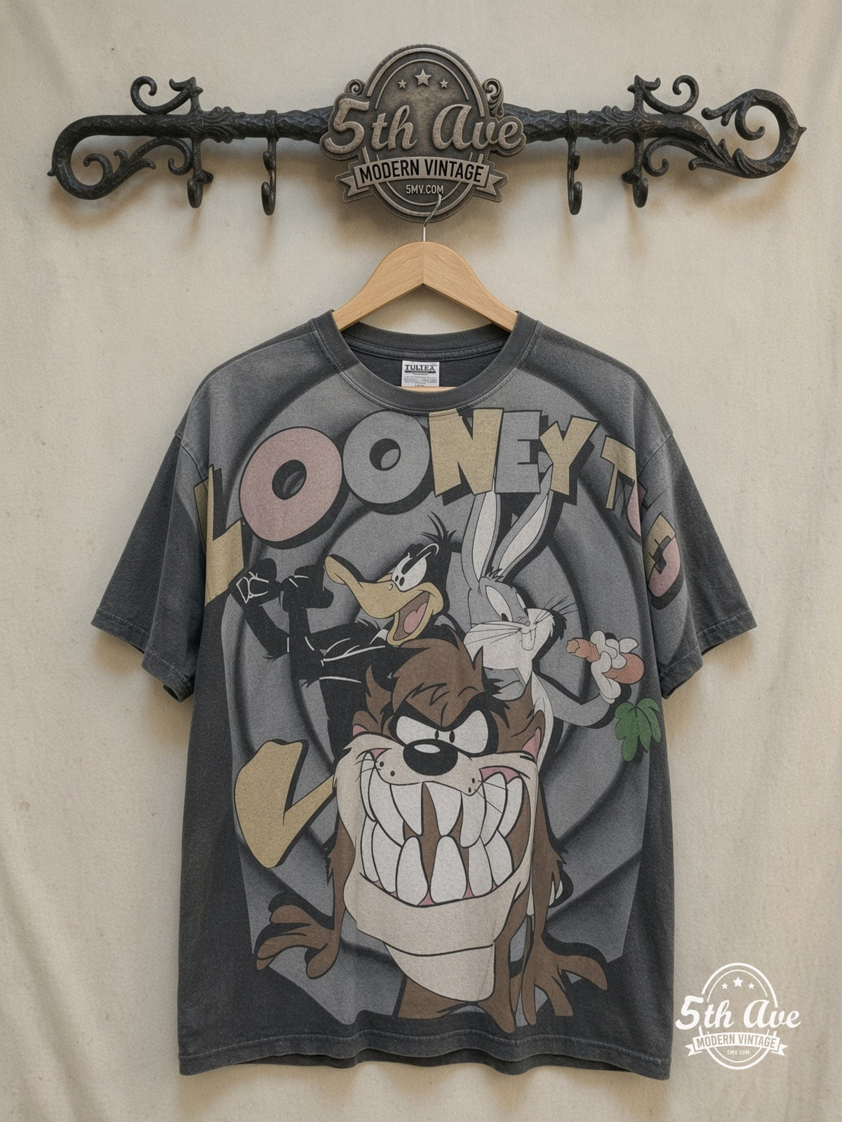 Bugs Bunny – Looney Tunes Bugs Bunny Daffy Duck and Taz-Mania – New Vintage Graphic Tee — front on locked cream ornate 5th Ave rack
