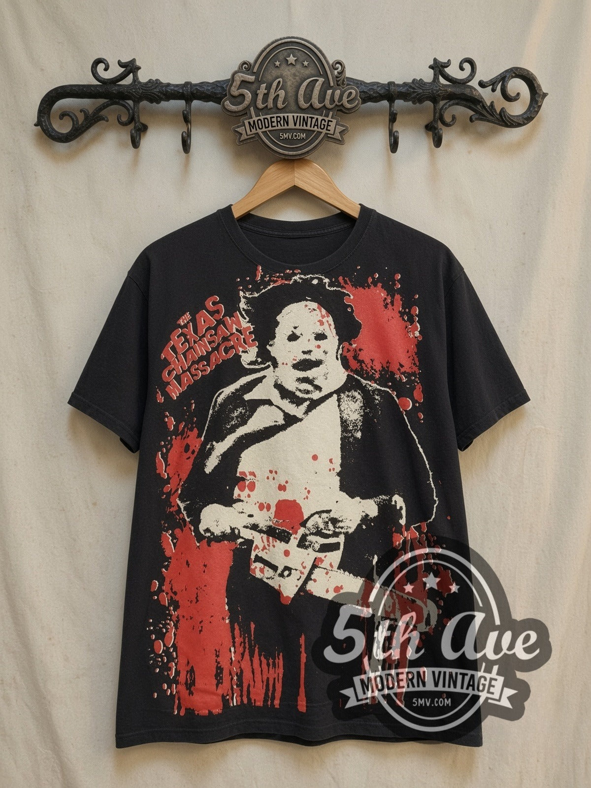 Texas Chainsaw Massacre Leatherface Horror all-over-print vintage graphic t-shirt, front view on a display rack
