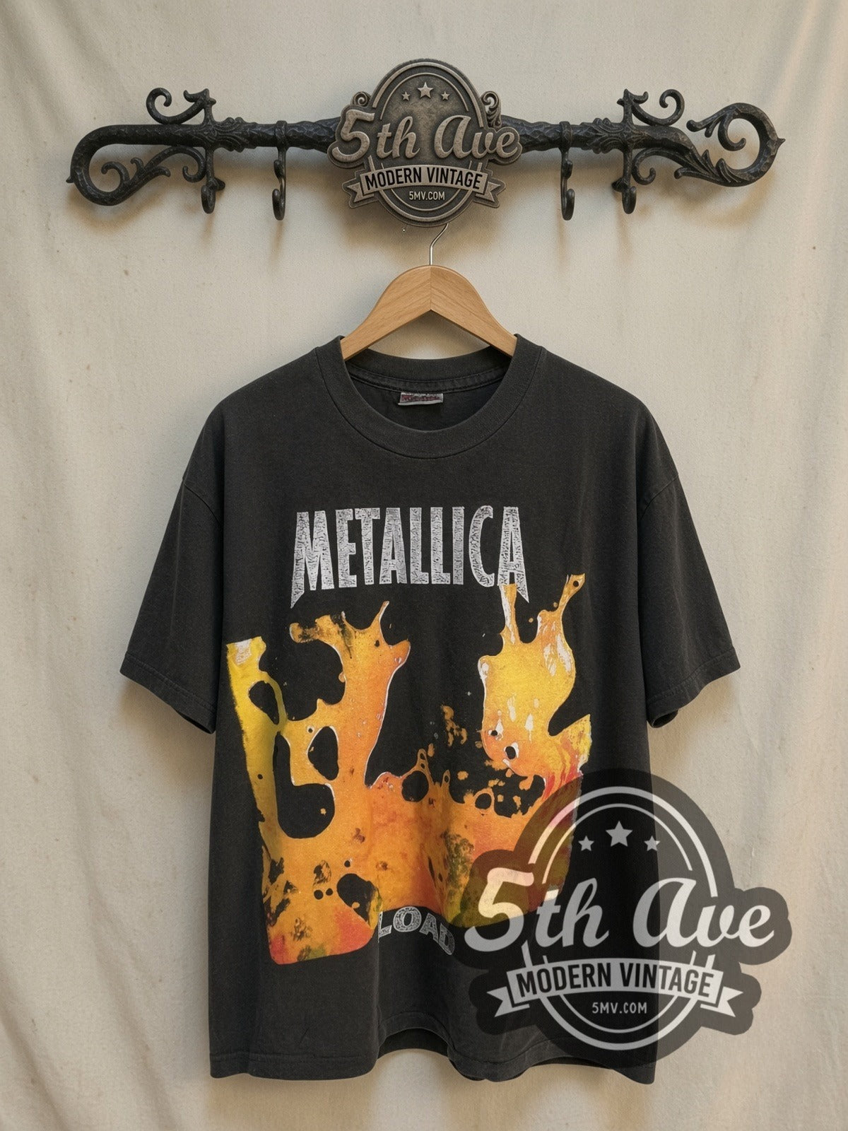 Metallica Load vintage band t-shirt, front view on a display rack