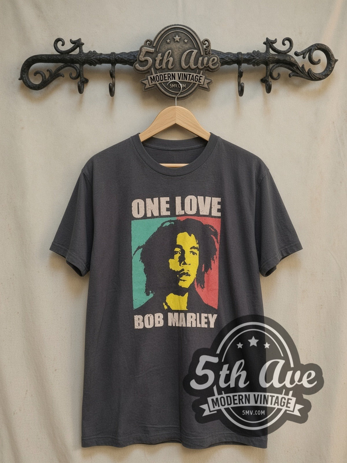 Bob Marley One Love vintage band t-shirt, front view on a display rack
