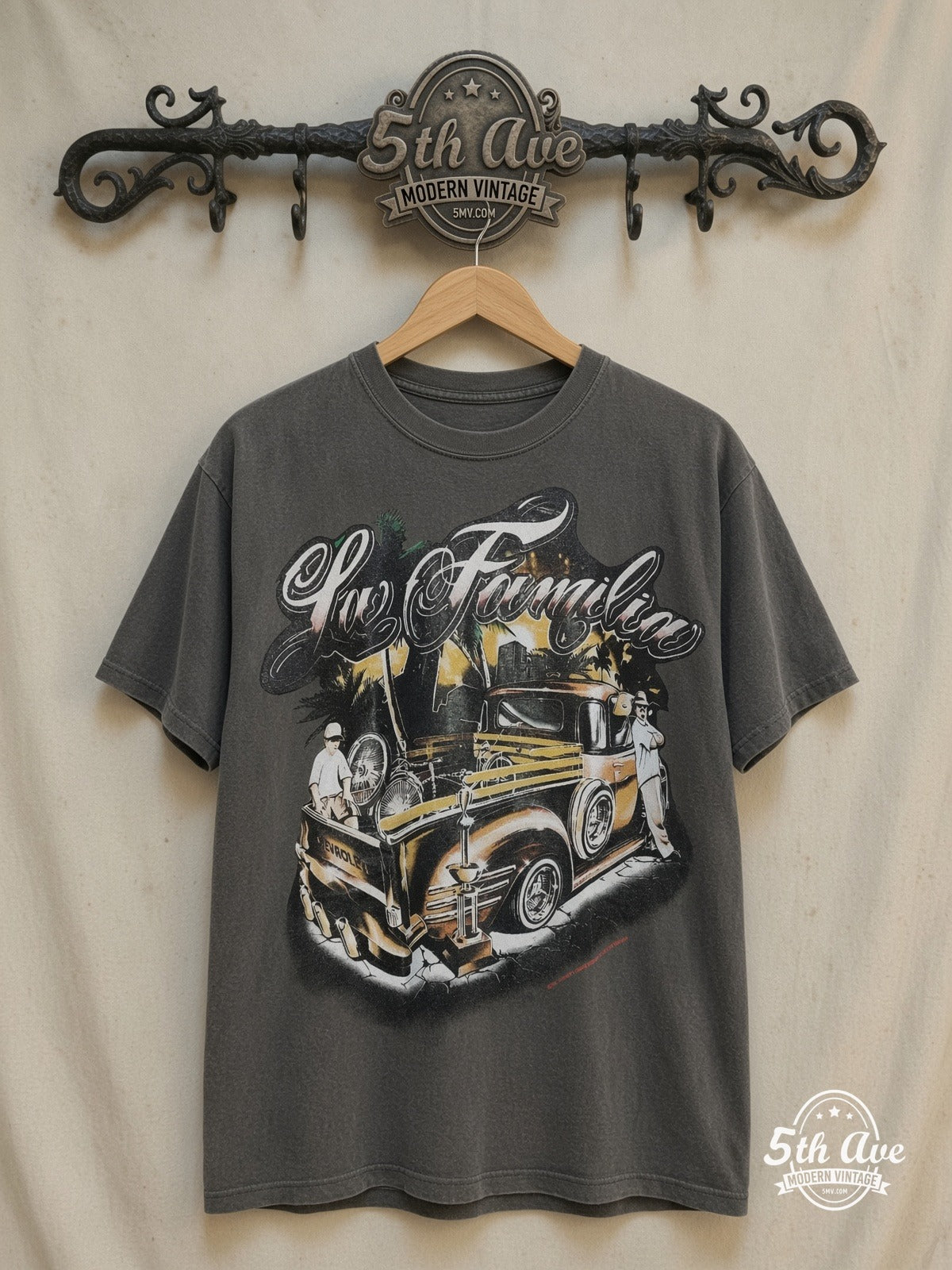 For Familia - Rollin hard lowrider low rider car culture t shirt – Vintage Band T-Shirt — front on locked cream ornate 5th Ave rack