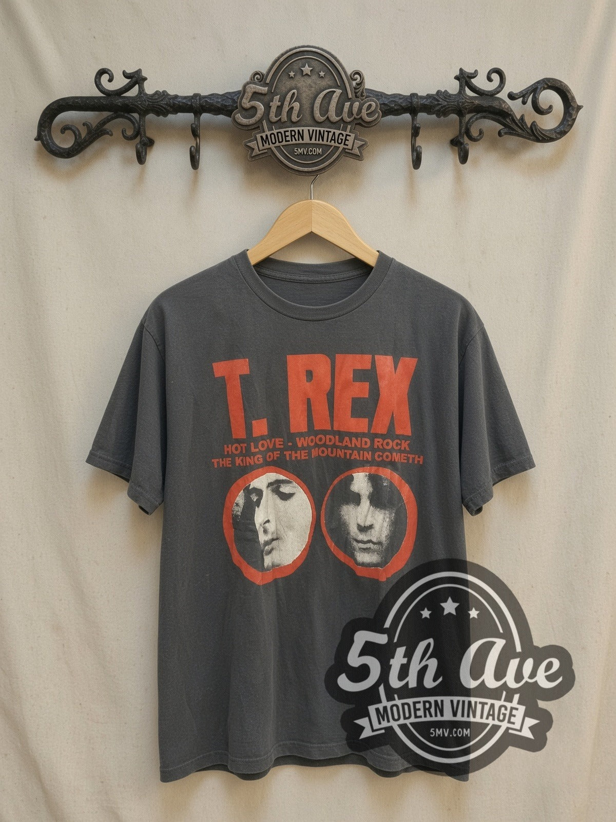 T. Rex Twin Portraits Logo vintage band t-shirt, front view on a display rack