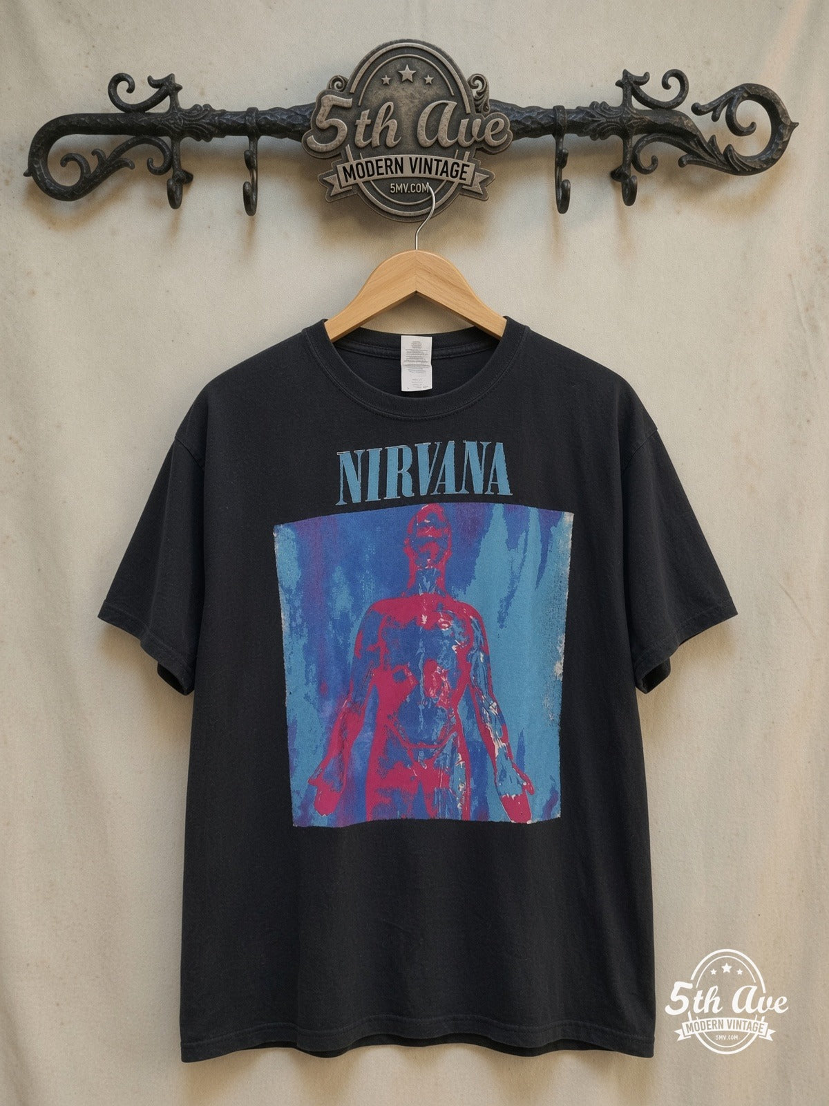 Nirvana – Sliver' Vintage-Inspired Tee: A Distressed Tribute to Grunge Royalty – Vintage Band T-Shirt — front on locked cream ornate 5th Ave rack