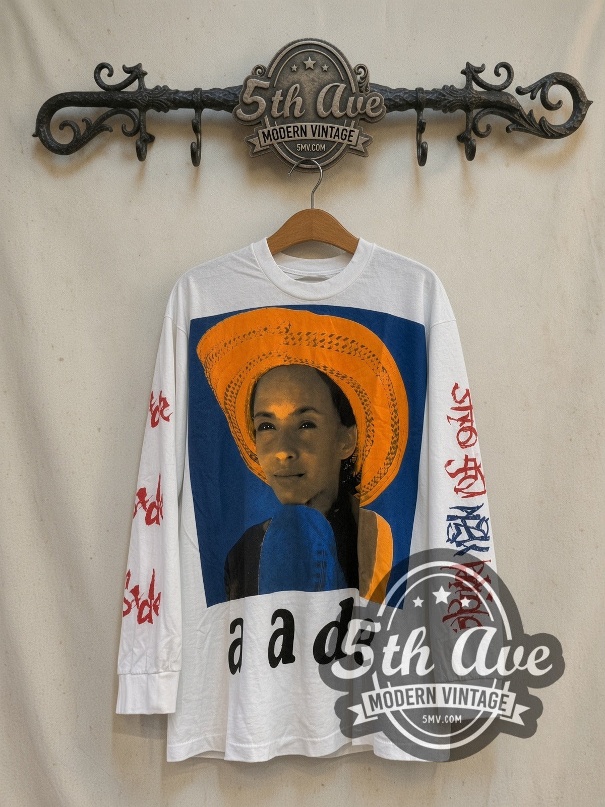 Sade Love Is Stronger Than Pride Long Sleeve vintage band t-shirt in white, front view on a display rack