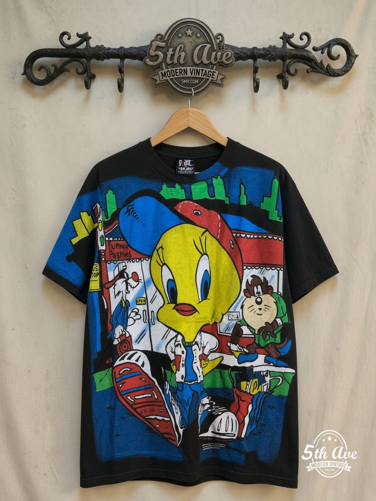 Looney Tunes – Tweety, Sylvester and Taz-Mania – All Over Print – New Vintage Graphic Tee — front on locked cream ornate 5th Ave rack
