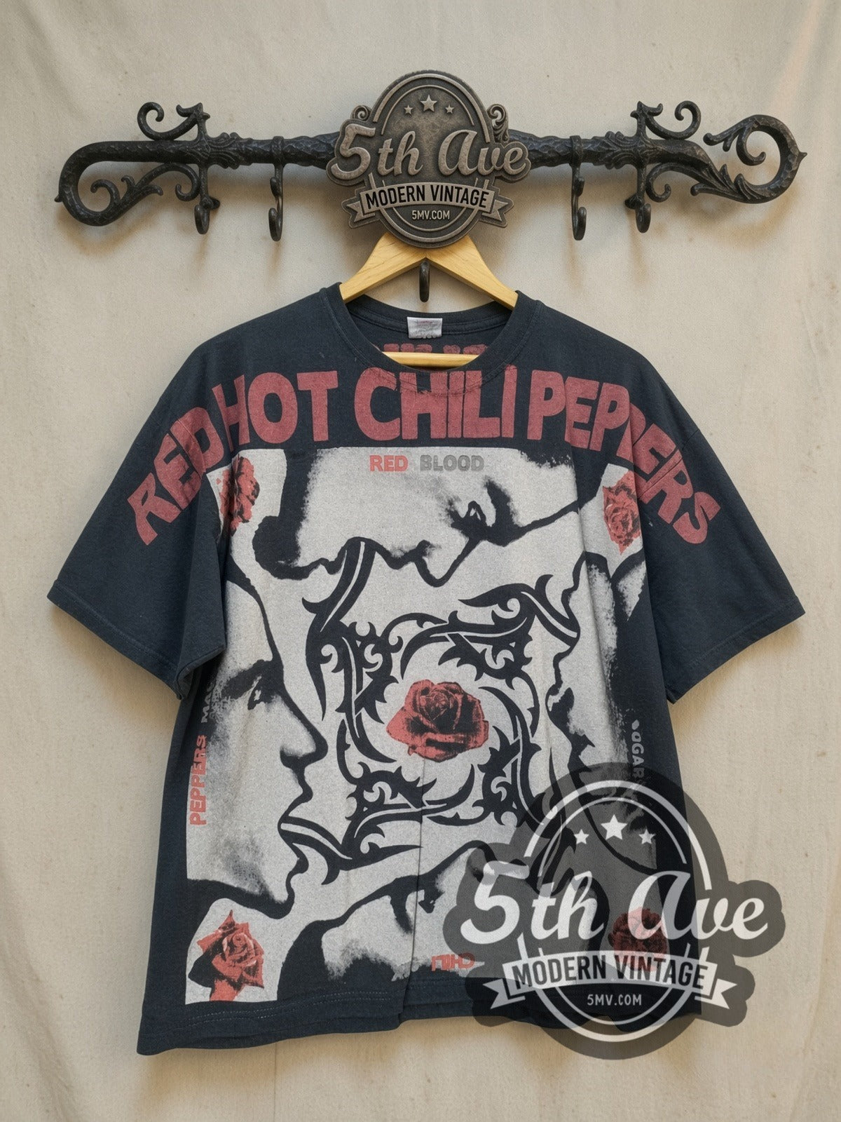 Red Hot Chili Peppers all-over-print vintage band t-shirt, front view on a display rack