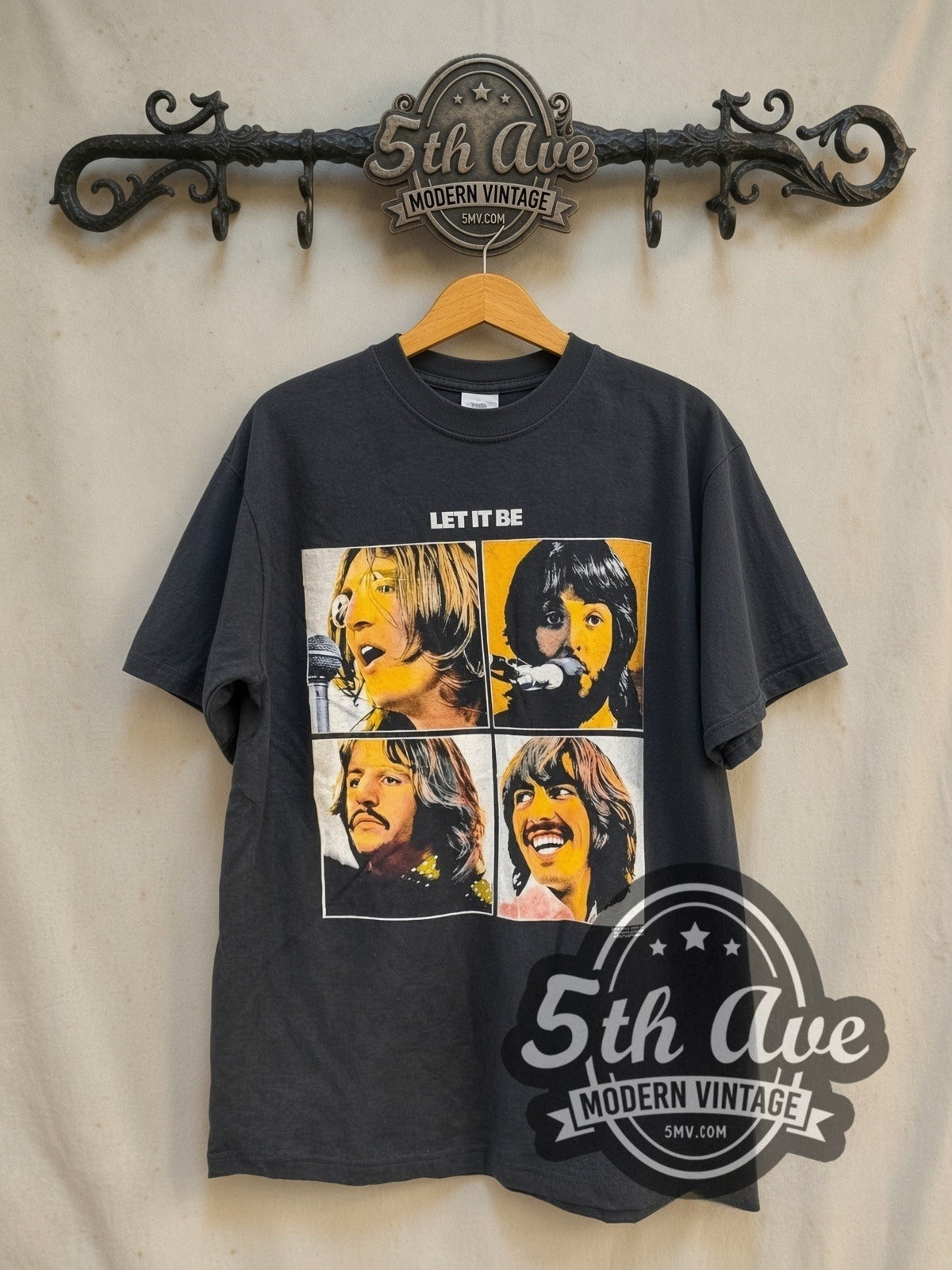 The Beatles Let It Be 1970 vintage band t-shirt in black, front view on a display rack
