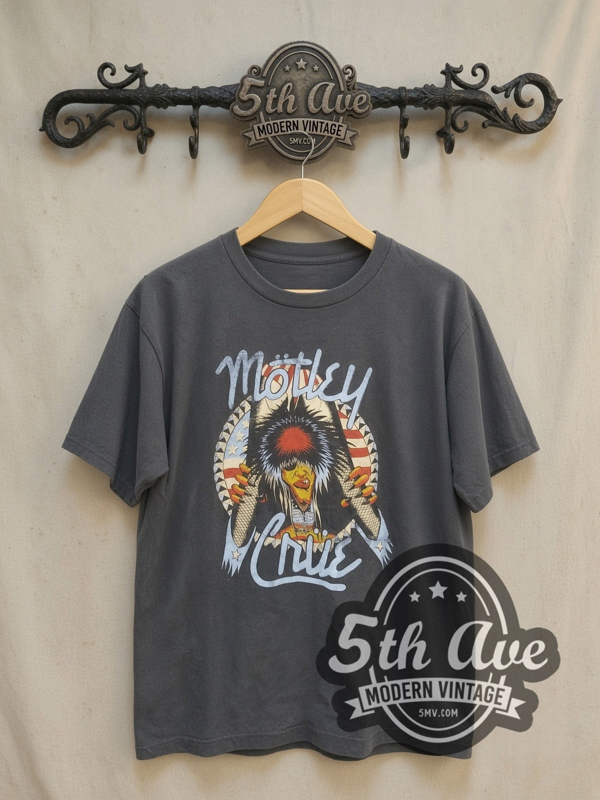 Mötley Crüe Nikki Sixx American Flag Breakthrough vintage band t-shirt, front view on a display rack