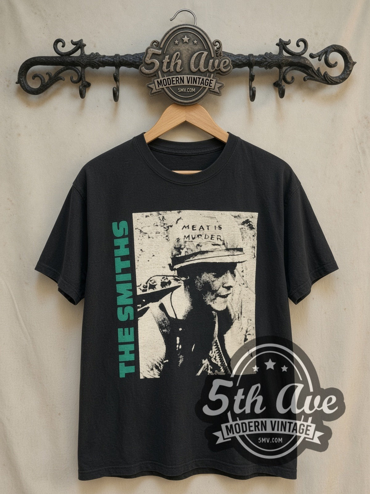 The Smiths Meat Is Murder vintage band t-shirt, front view on a display rack