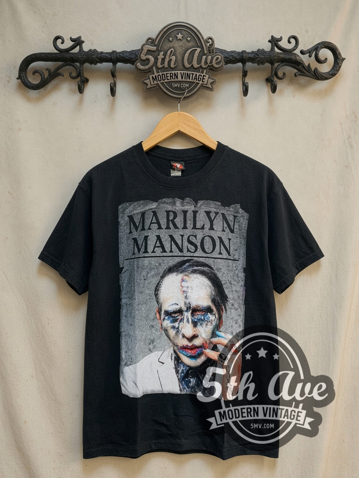 Marilyn Manson Clown Makeup Portrait vintage band t-shirt, front view on a display rack