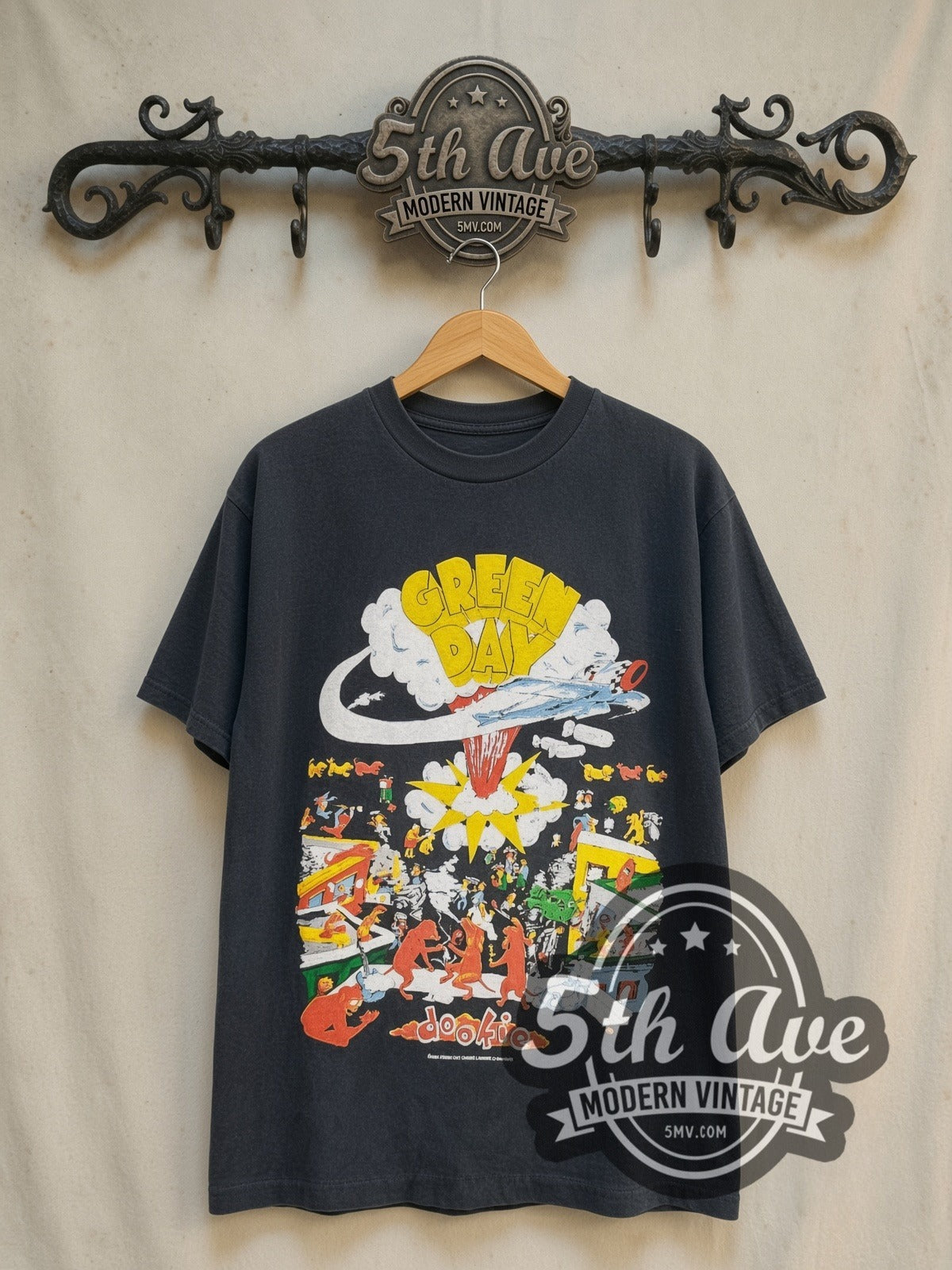 Green Day Dookie Tour 1994 vintage band t-shirt in black, front view on a display rack