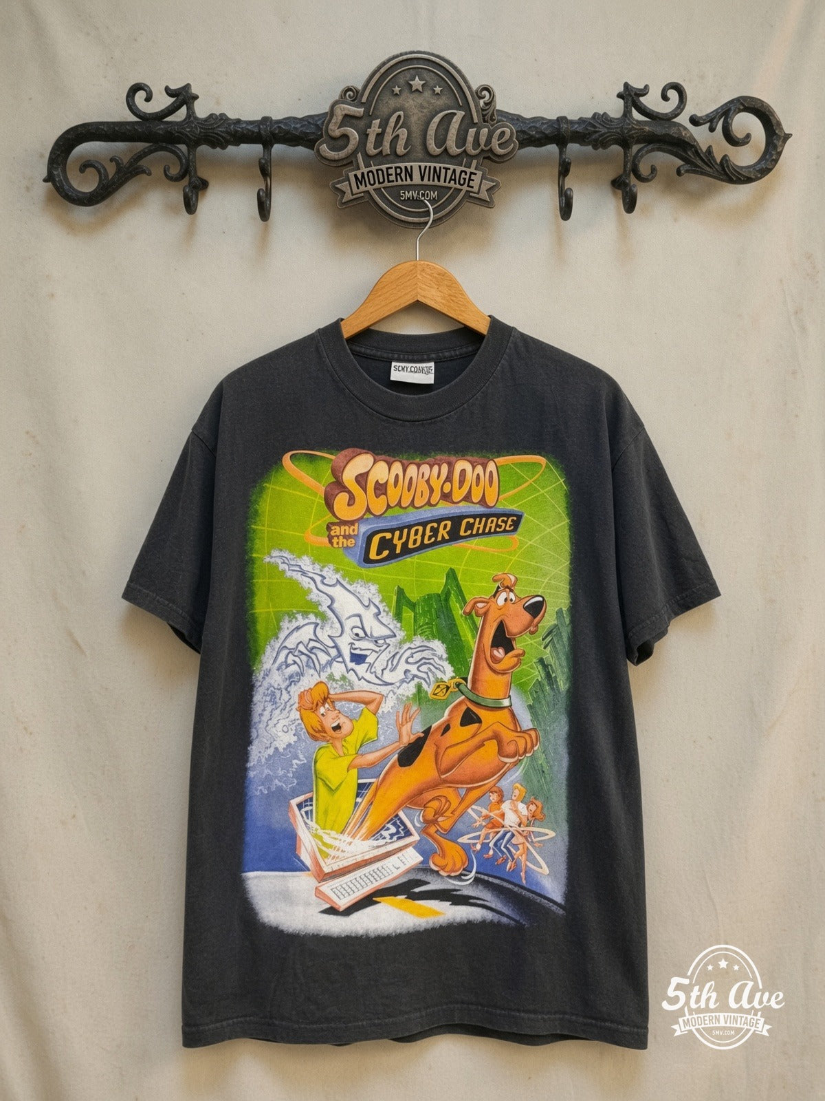 Scooby-Doo Cyber Chase all-over-print vintage cartoon tee in black, front view on a display rack
