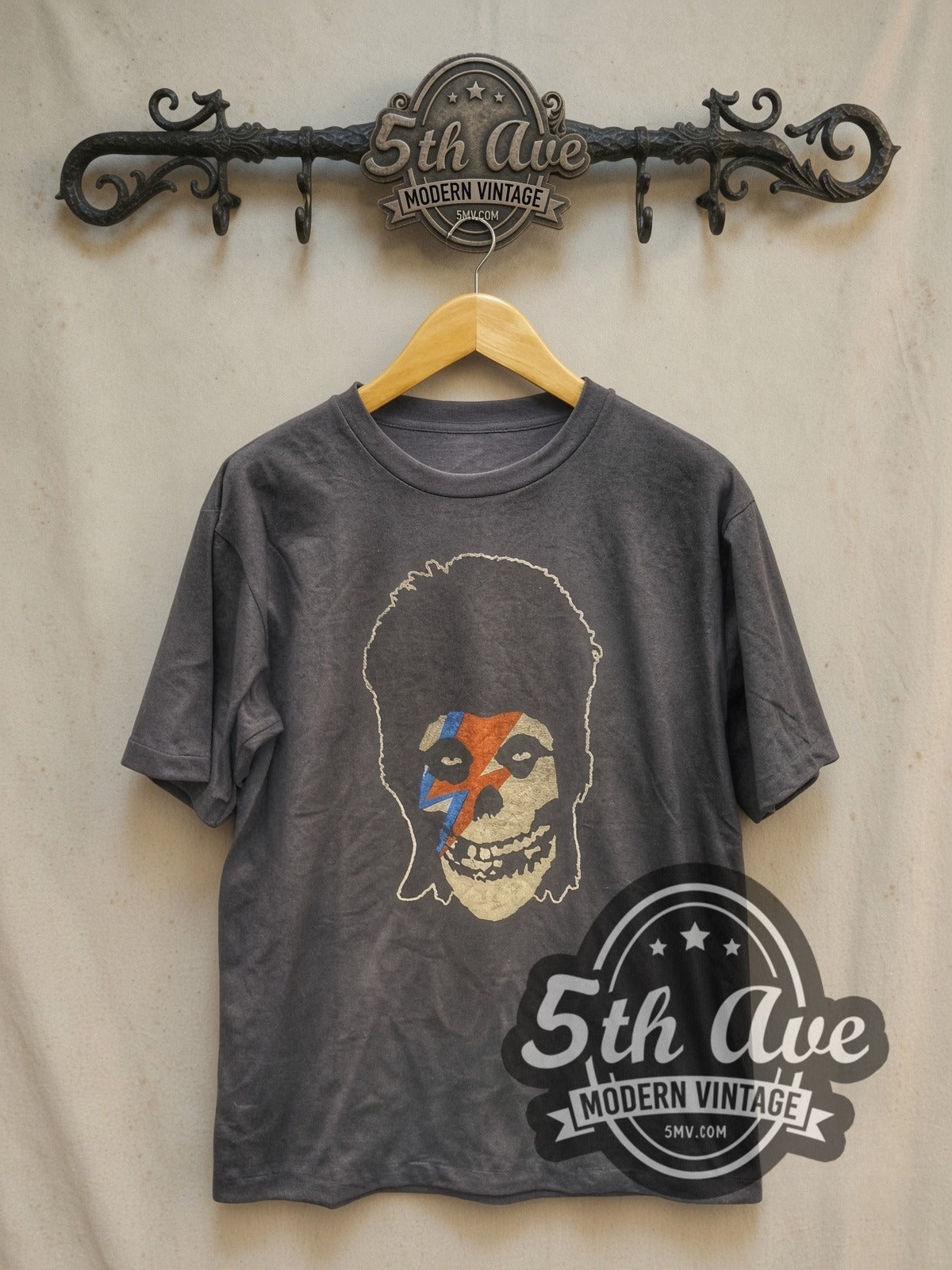 David Bowie Lightning Bolt Skull vintage band t-shirt, front view on a display rack