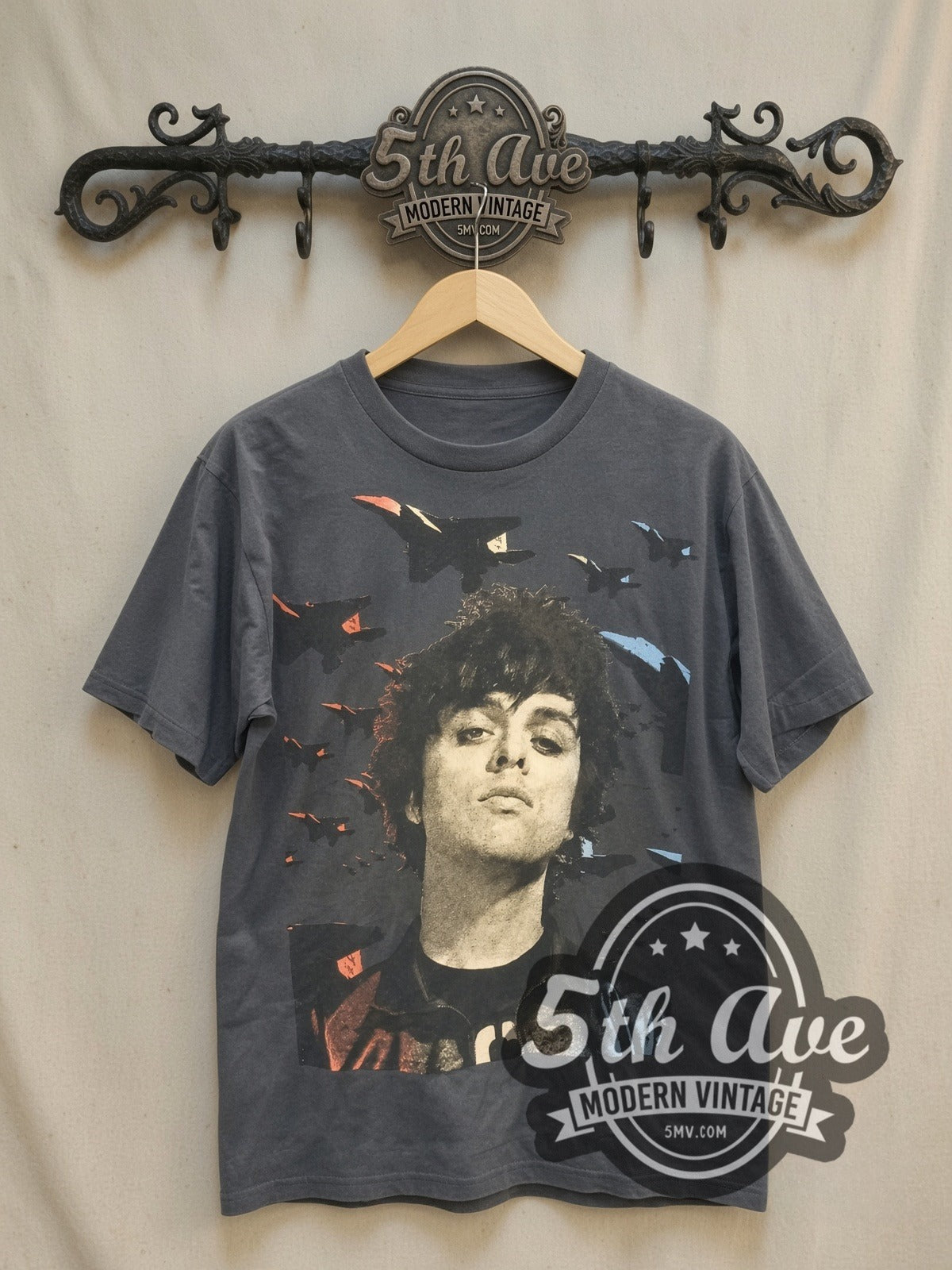 Green Day Frontman Portrait vintage band t-shirt, front view on a display rack