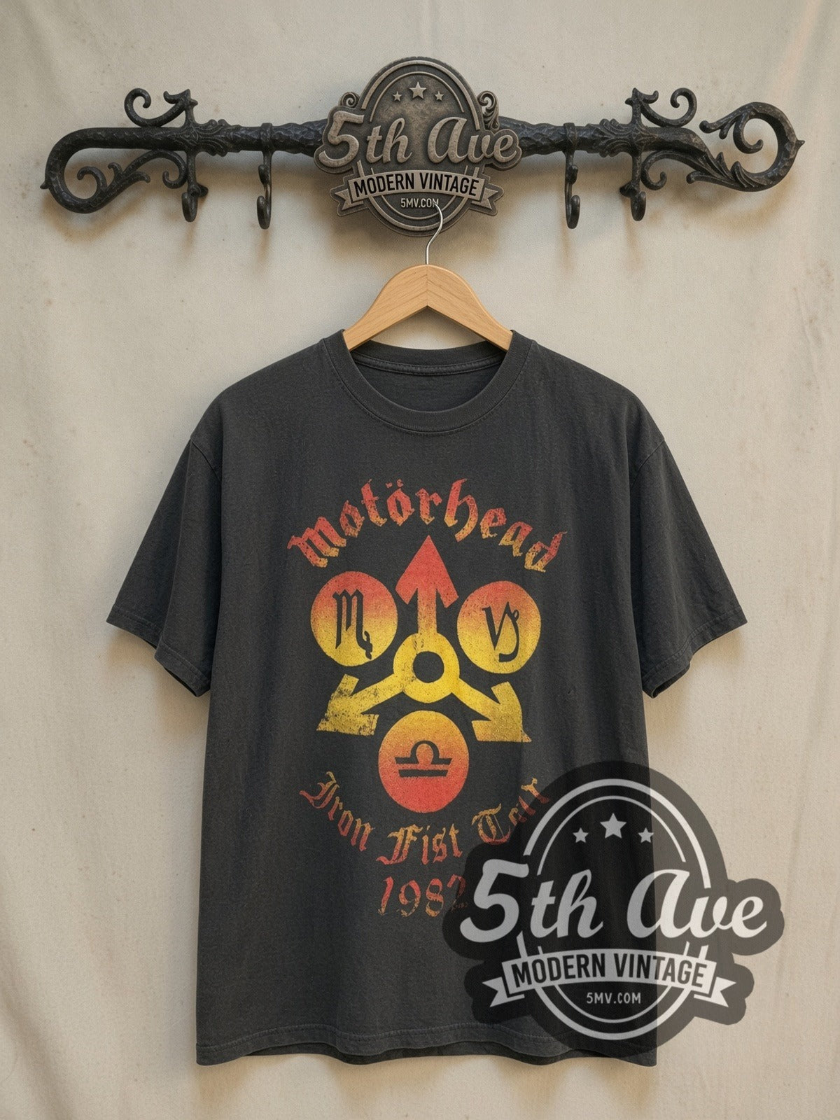 Motörhead Iron Fist Tour 1982 vintage band t-shirt, front view on a display rack