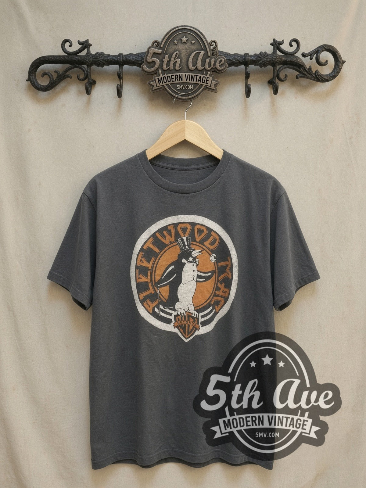 Fleetwood Mac Penguin Logo vintage band t-shirt, front view on a display rack