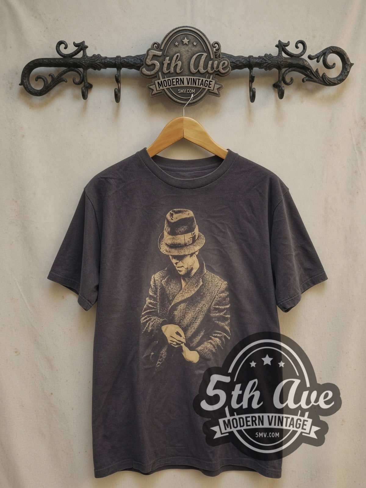 Tom Waits vintage band t-shirt, front view on a display rack
