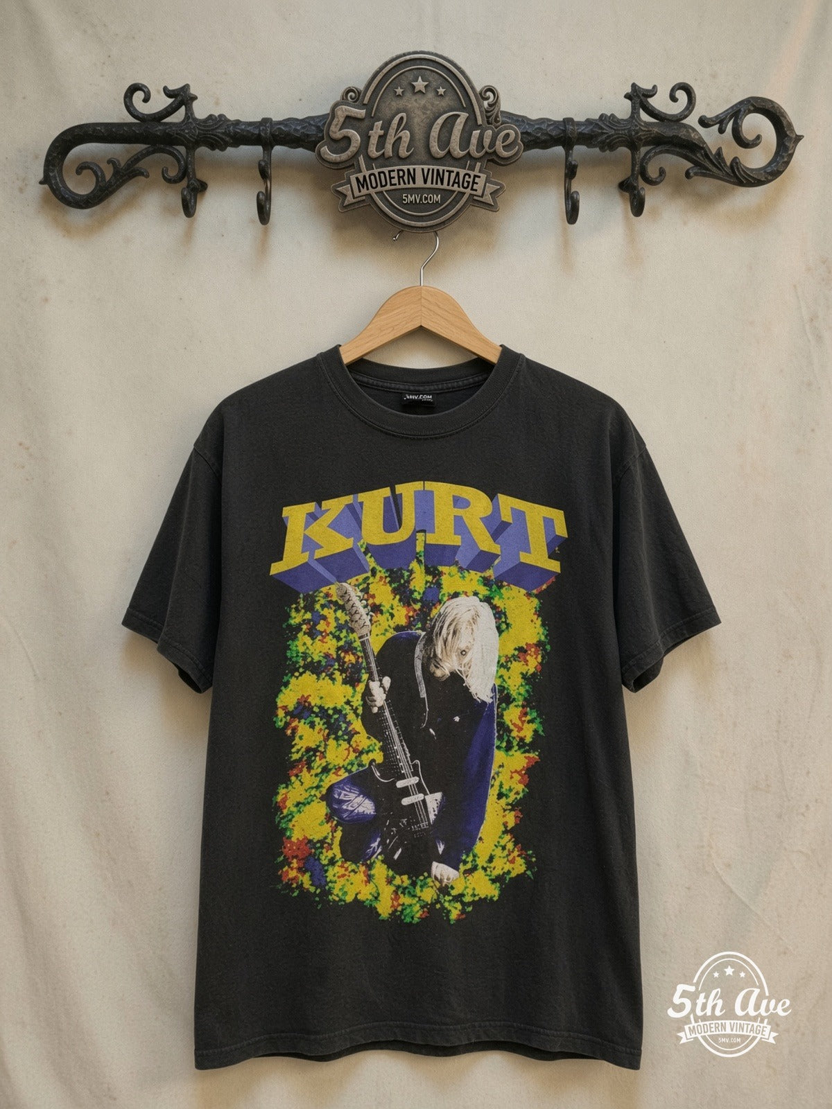 Nirvana – Kurt 3D Lettering Blue Eyes Guitar Memorial – Vintage Band T-Shirt — front on locked cream ornate 5th Ave rack