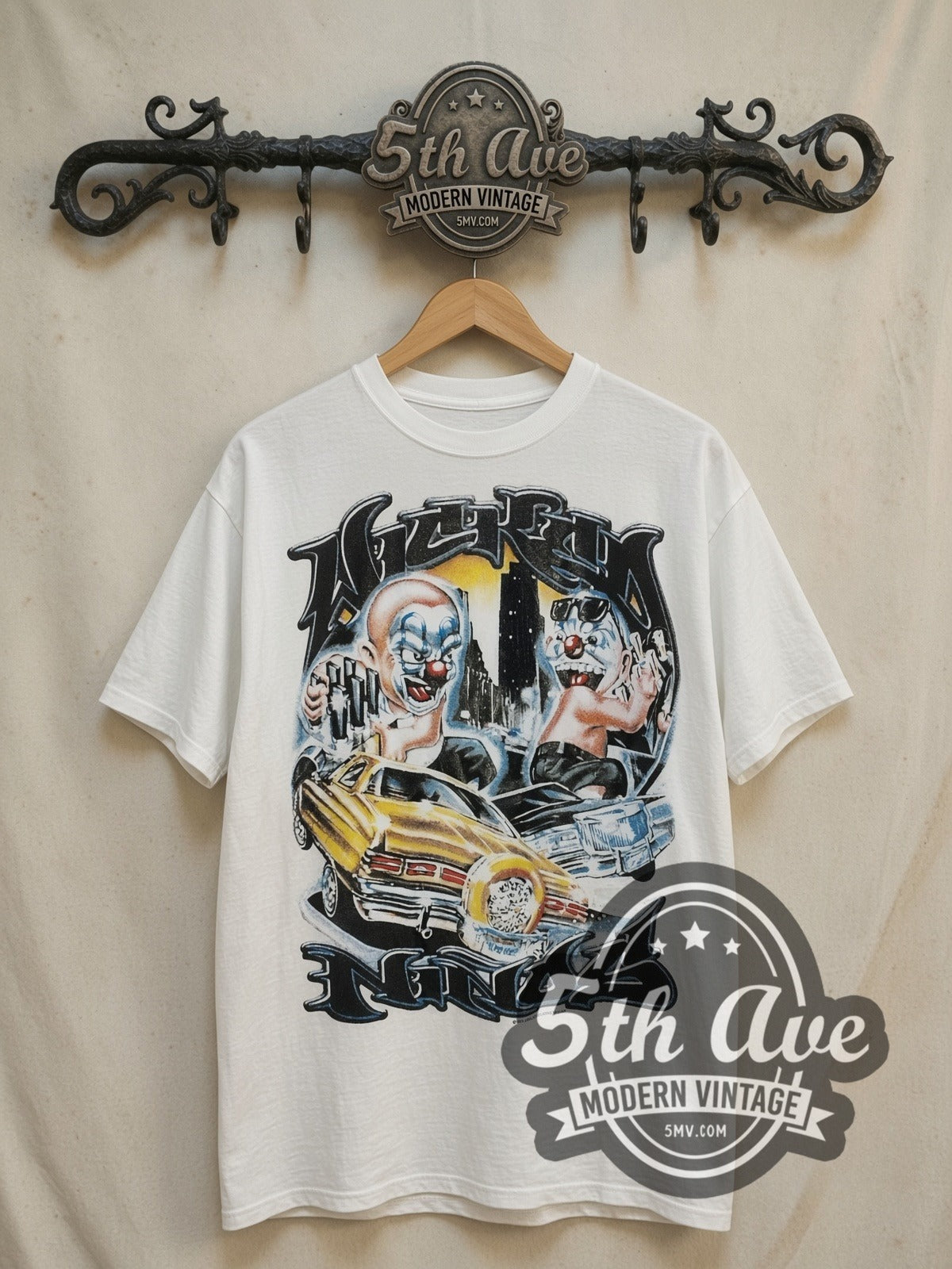 Rollin Hard Lowrider Clowns Unleashed vintage graphic tee, front view on a display rack