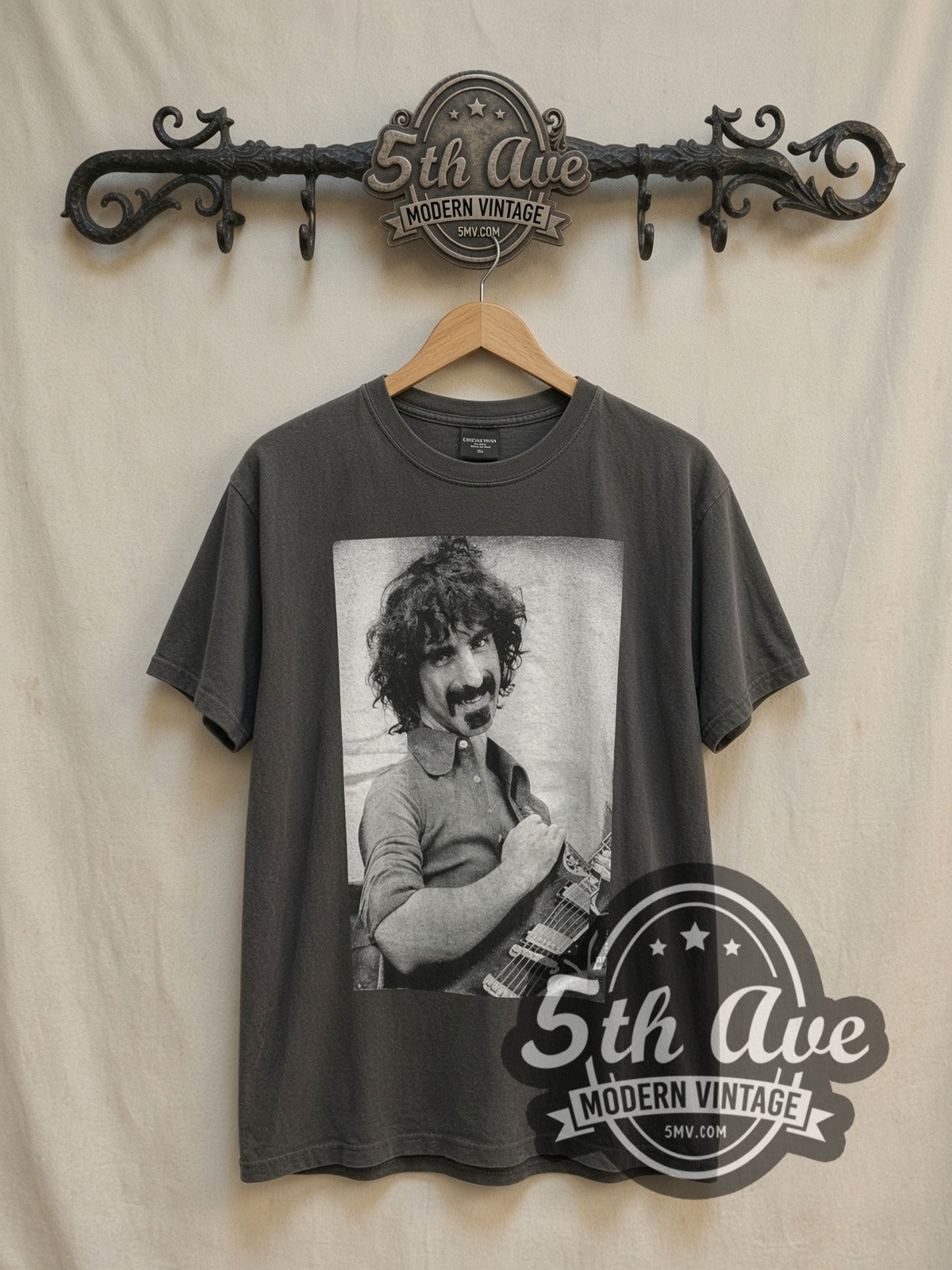 Frank Zappa Playing Guitar B&W Photo vintage band t-shirt, front view on a display rack