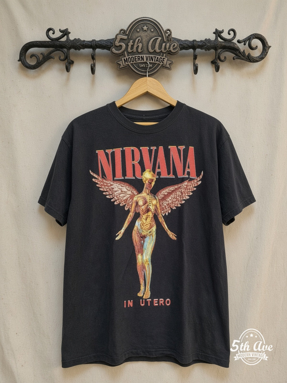 Nirvana – In Utero Red Outline Angel Pink Wings – Vintage Band T-Shirt — front on locked cream ornate 5th Ave rack