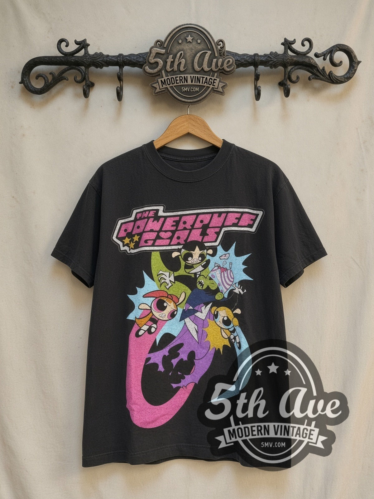 The Powerpuff Girls Vs. Mojo Jojo graphic tee in black, front view on a display rack