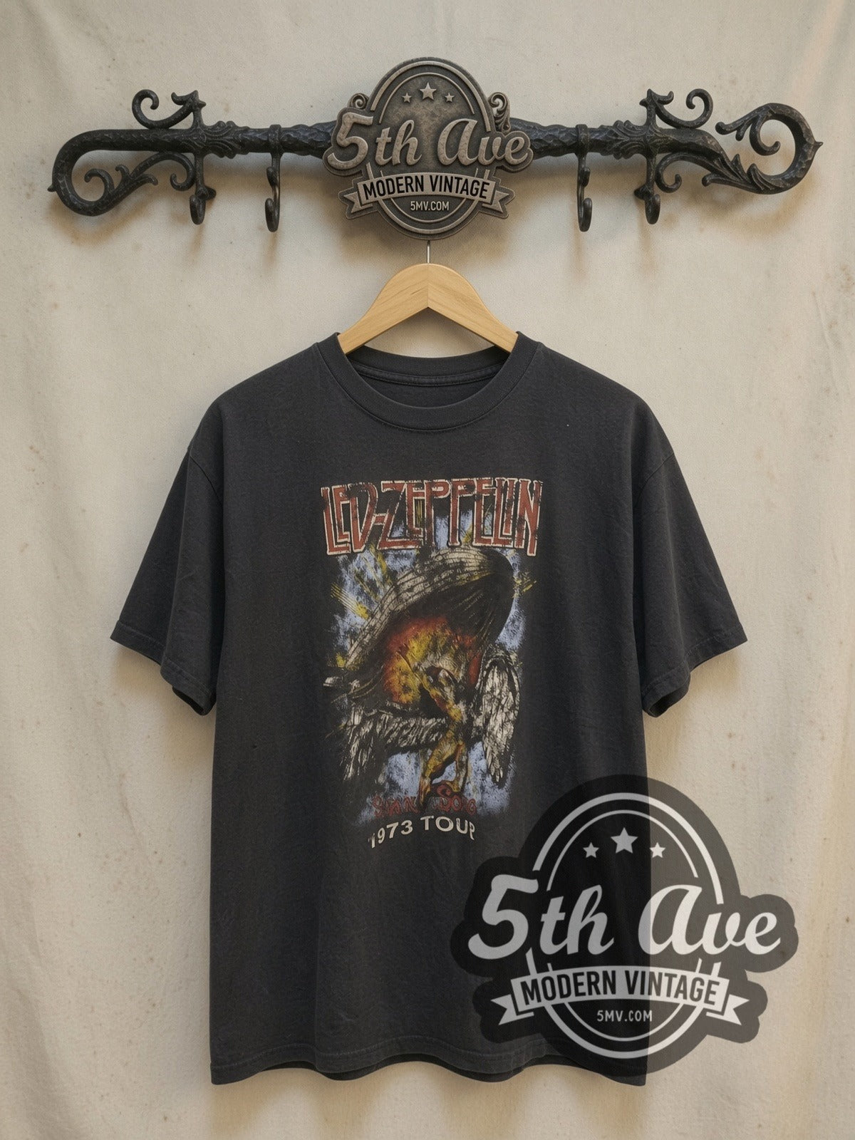 Led Zeppelin 1973 Tour Angel & Zeppelin vintage band t-shirt in black, front view on a display rack