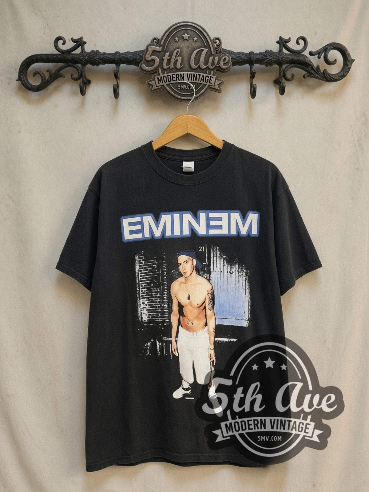 Eminem Pinhead "EMINƎM vintage band t-shirt in black, front view on a display rack