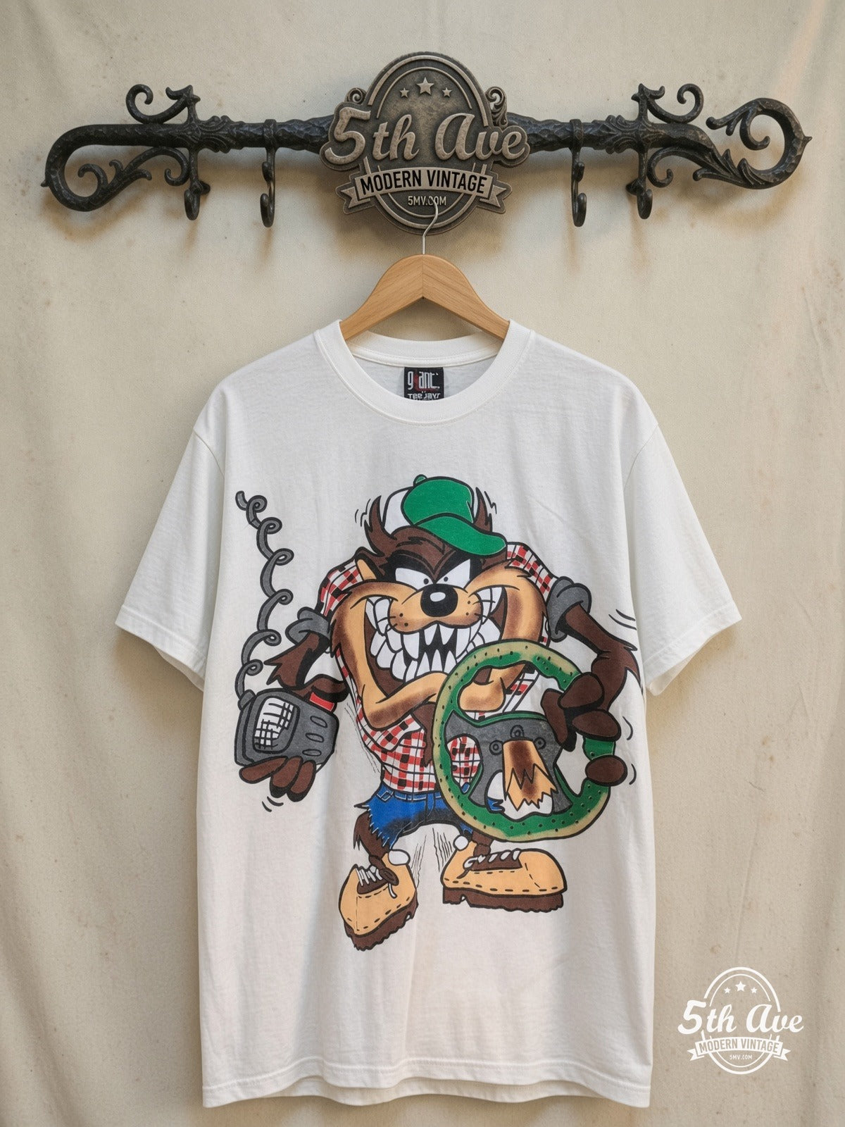 Looney Tunes – Taz Truckin Company – New Vintage Graphic Tee — front on locked cream ornate 5th Ave rack
