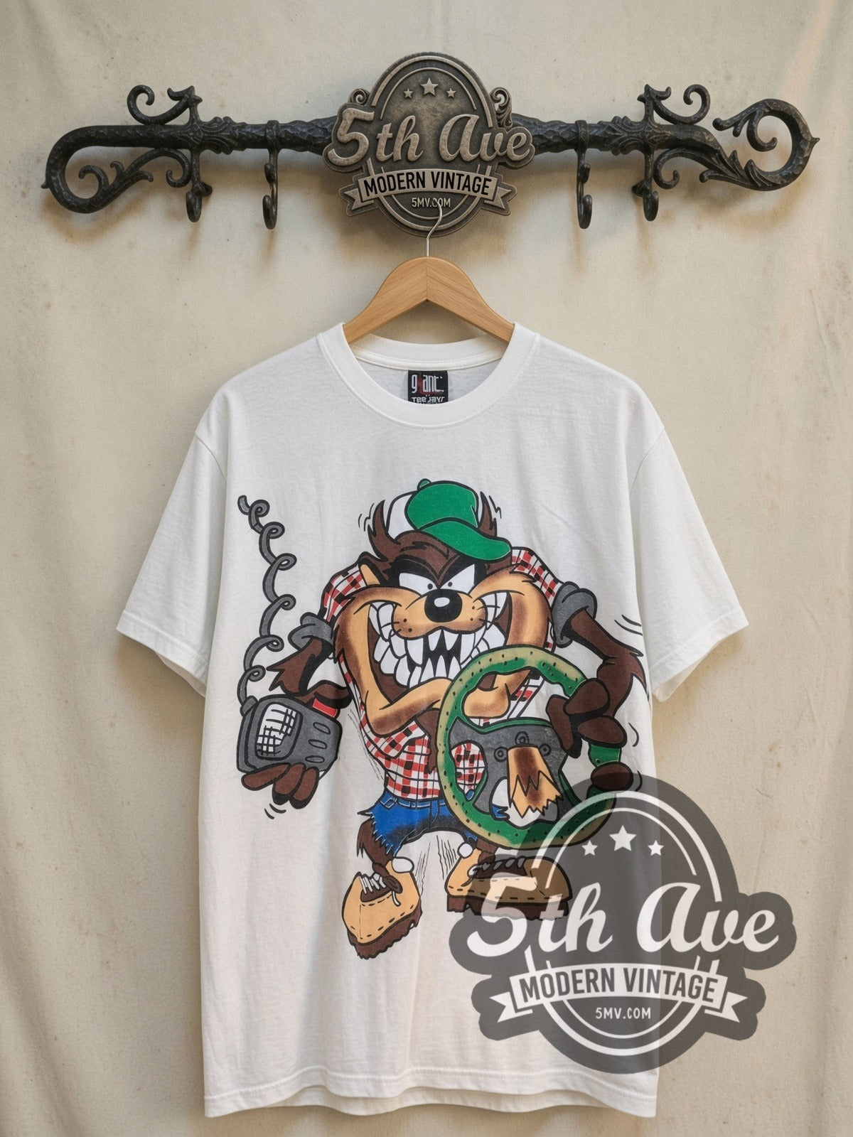 Looney Tunes Taz Truckin Company vintage cartoon tee, front view on a display rack