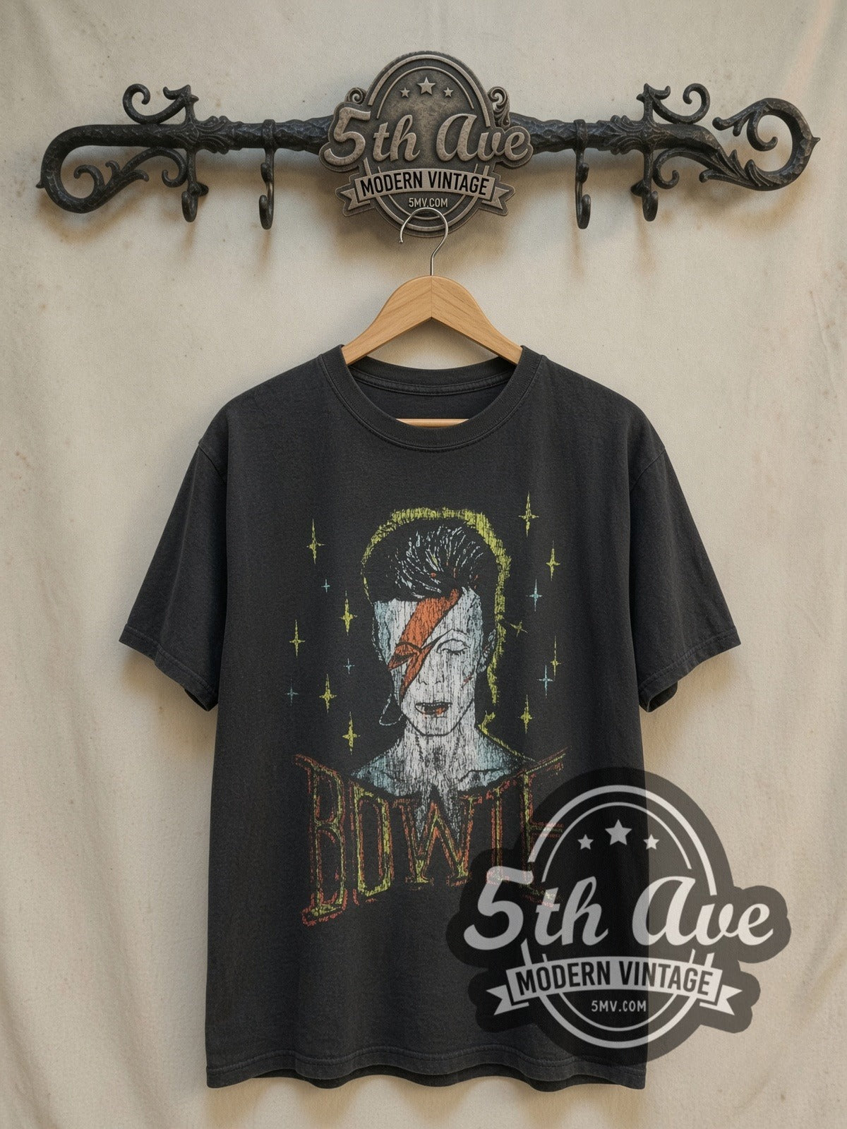 David Bowie 1976 World Tour vintage band t-shirt, front view on a display rack