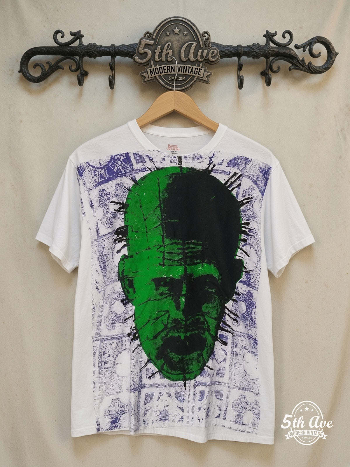 Hellraiser Pinhead the Hell Priest all-over-print movie tee, front view on a display rack