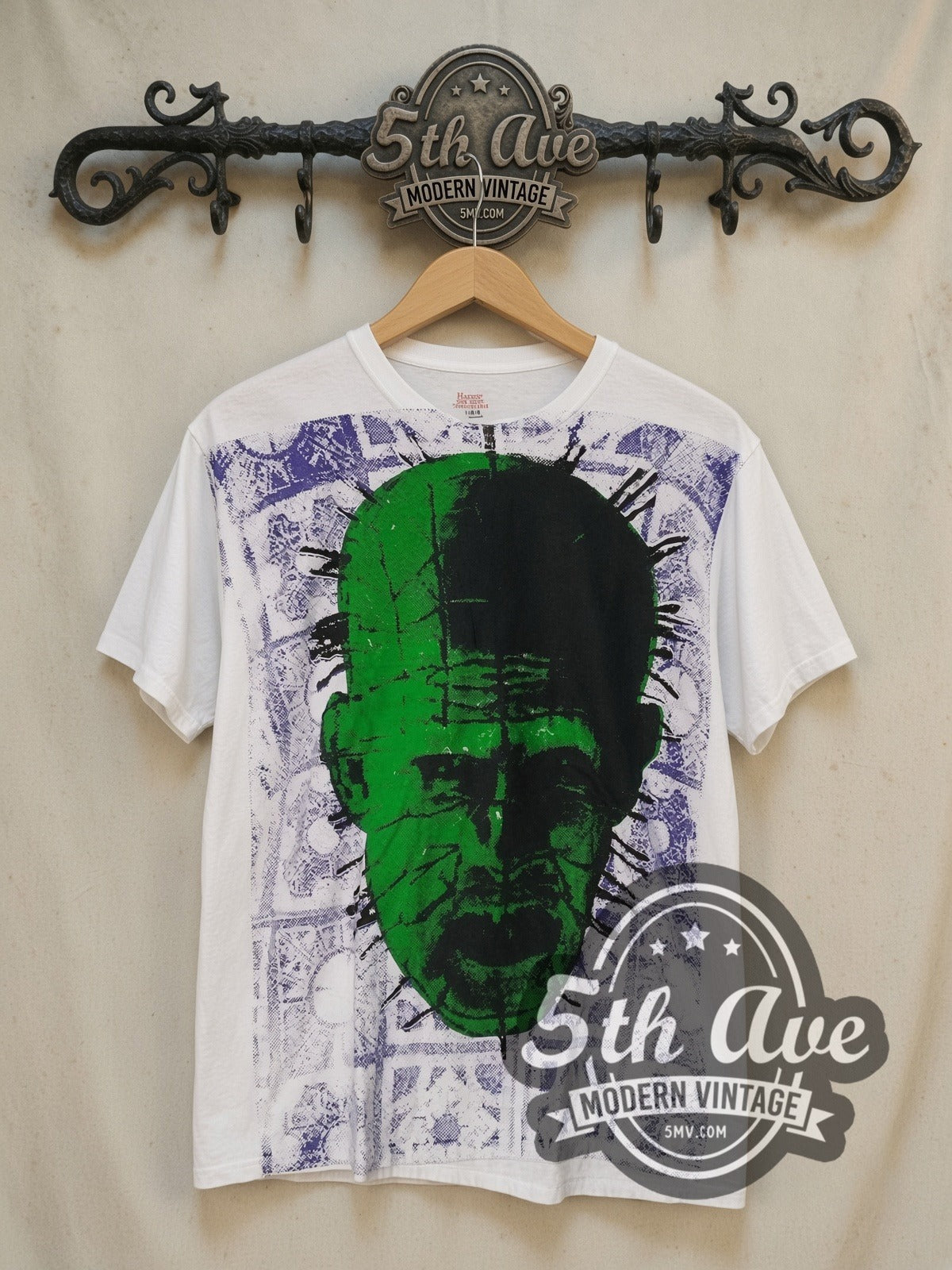 Hellraiser Pinhead the Hell Priest all-over-print vintage graphic t-shirt, front view on a display rack