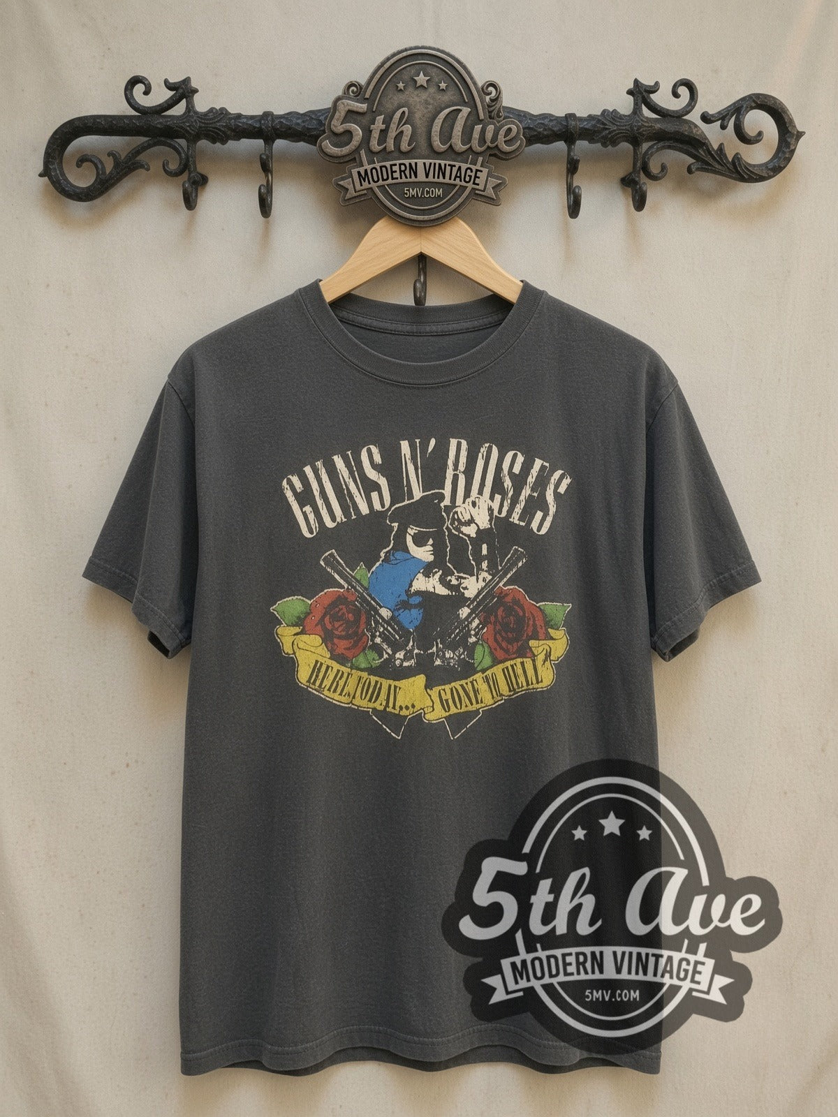 Guns N' Roses Skull and Roses Banner vintage band t-shirt, front view on a display rack
