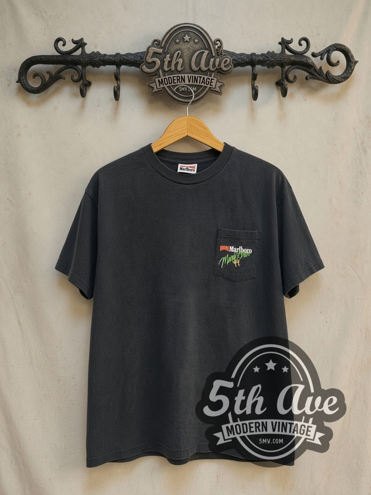 Marlboro Mardi Gras 1994 graphic tee in black, front view on a display rack