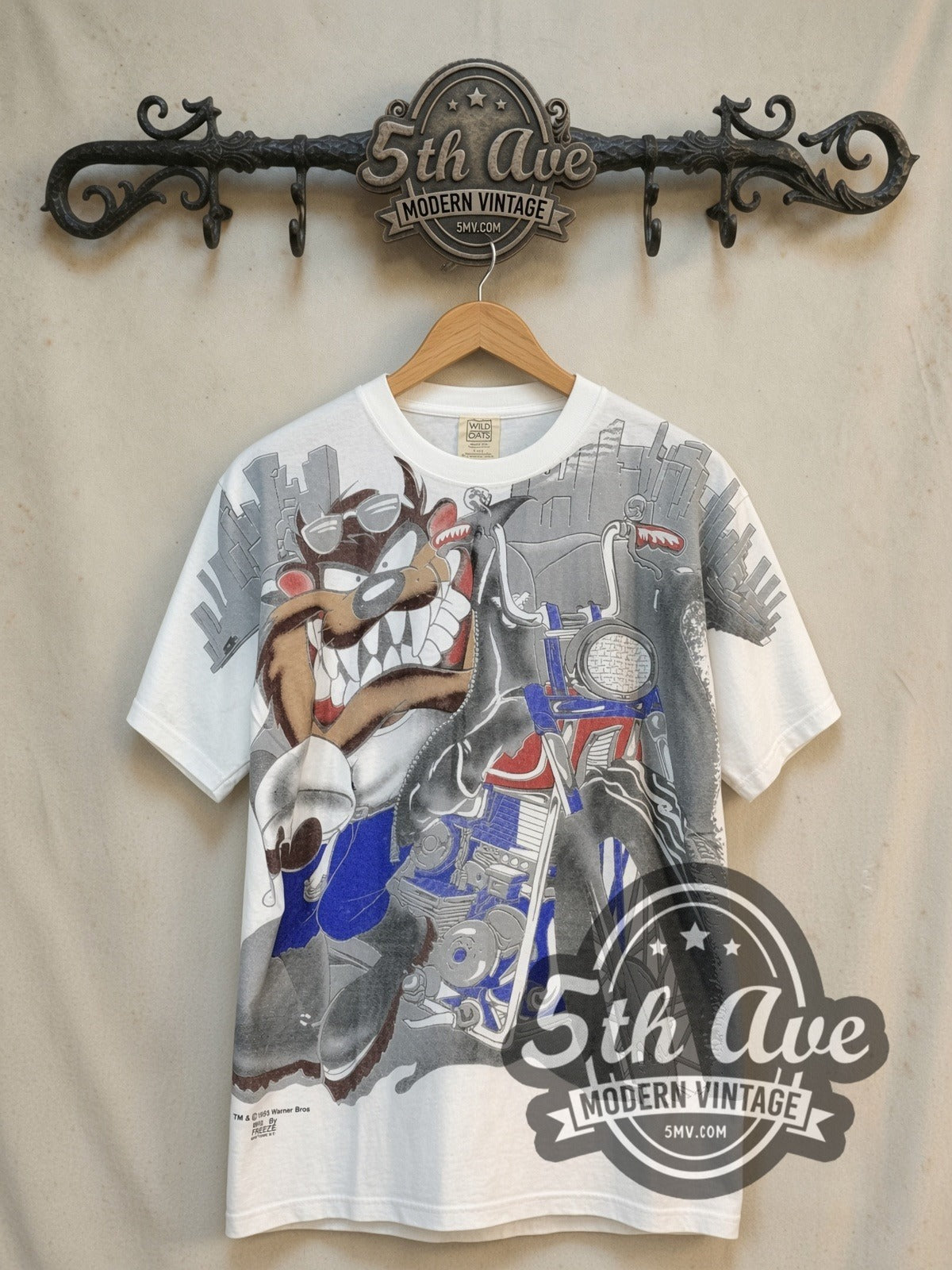Looney Tunes Taz-Mania Animation Devil all-over-print vintage cartoon tee, front view on a display rack
