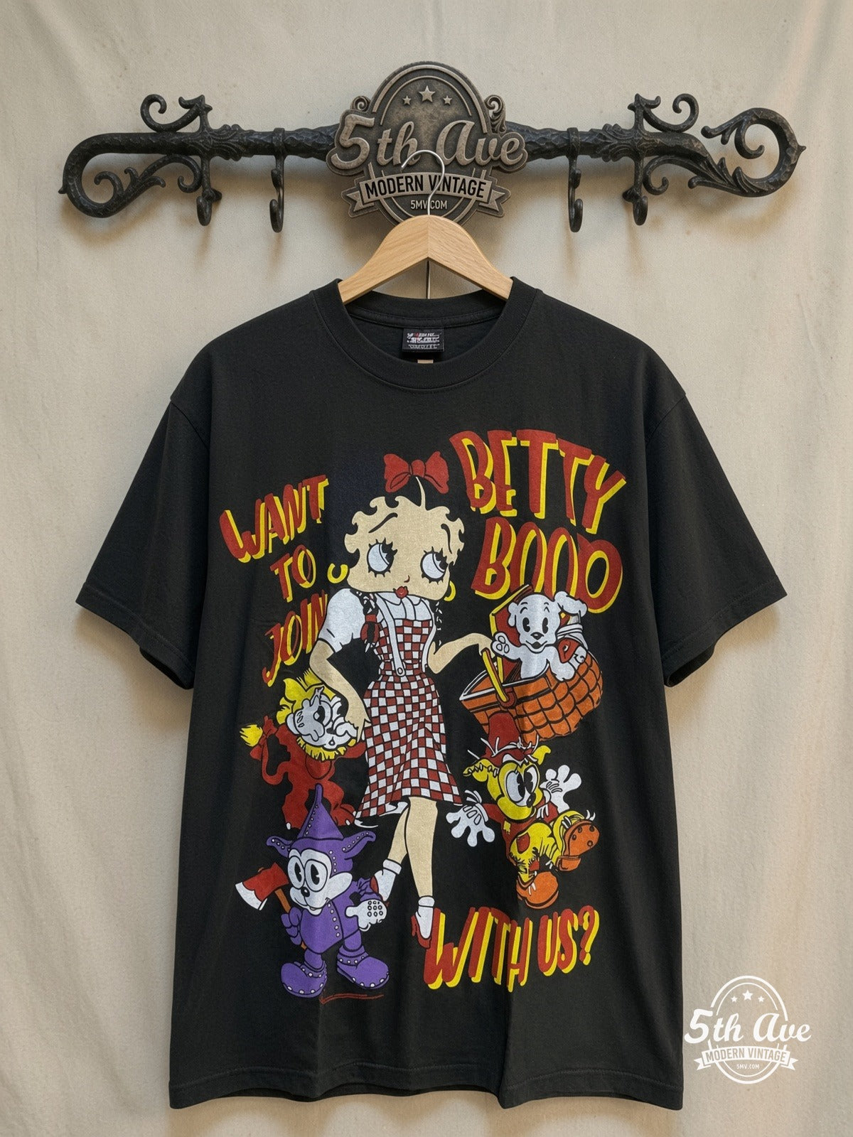 Betty Boop – Happy Holidays - AOP all over print New Vintage Animation T-Shirt – New Vintage Graphic Tee — front on locked cream ornate 5th Ave rack