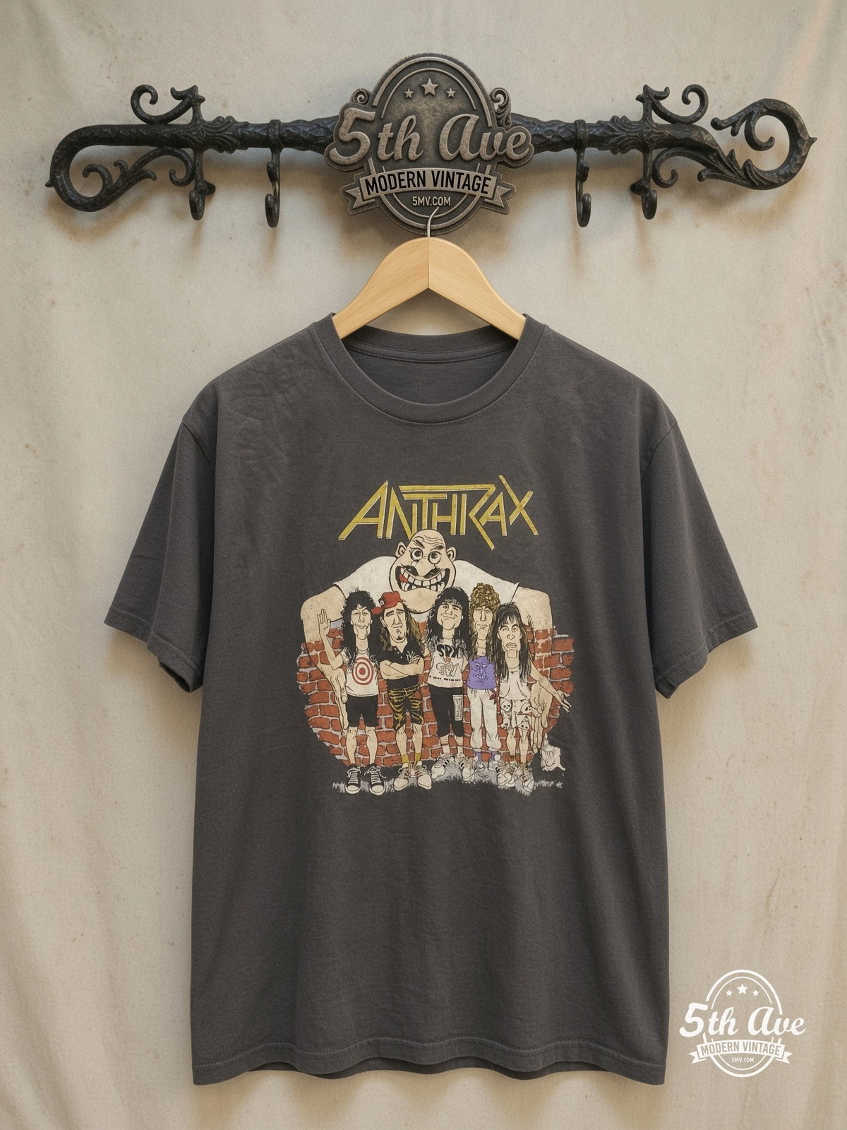 ANTHRAX 100% Cotton New Vintage Band T-Shirt – New Vintage Graphic Tee — front on locked cream ornate 5th Ave rack