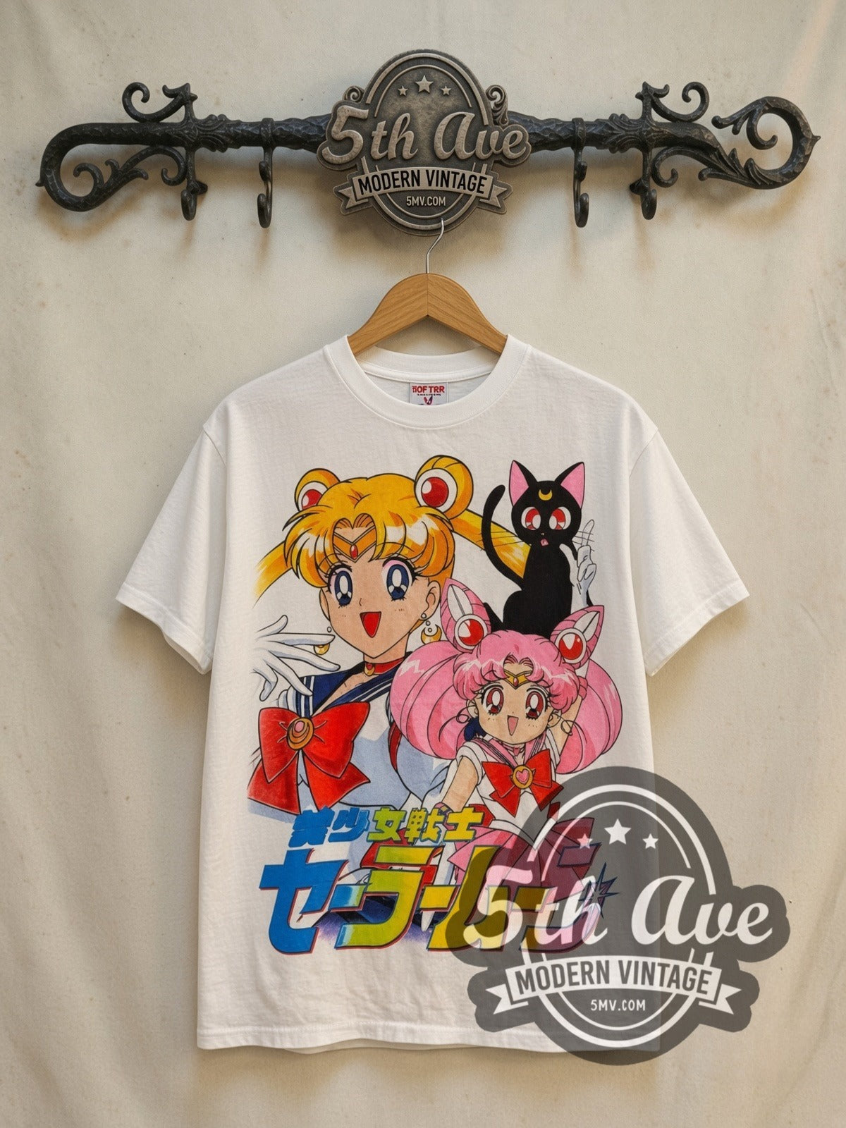 Sailor Moon Sailor Chibi Moon and Luna vintage graphic t-shirt, front view on a display rack