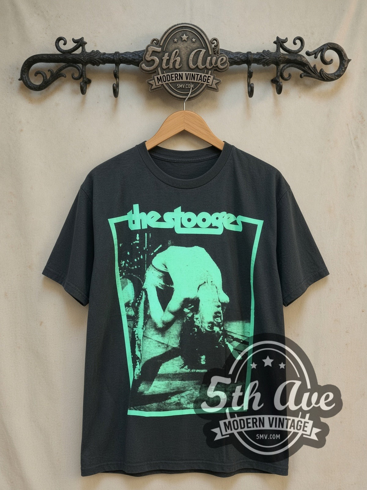 Iggy and The Stooges Turquoise Bend vintage band t-shirt, front view on a display rack
