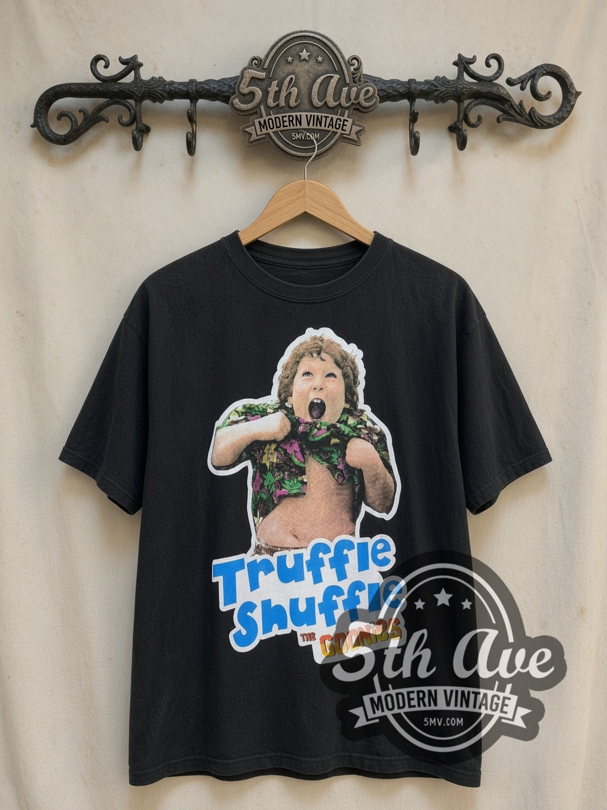 The Goonies Truffle Shuffle vintage movie t-shirt, front view on a display rack