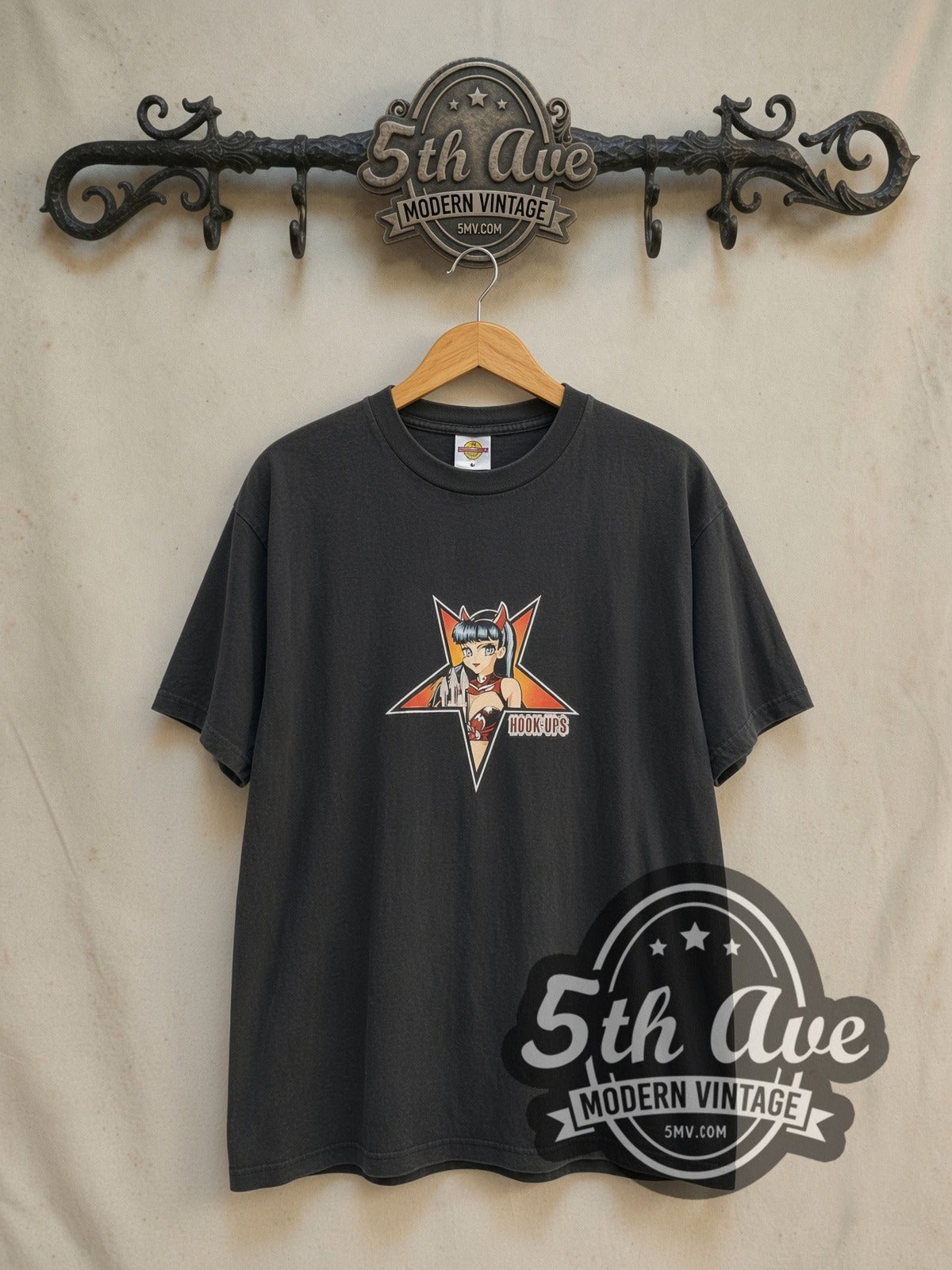 Hook-Ups Devil Girl graphic tee in black, front view on a display rack