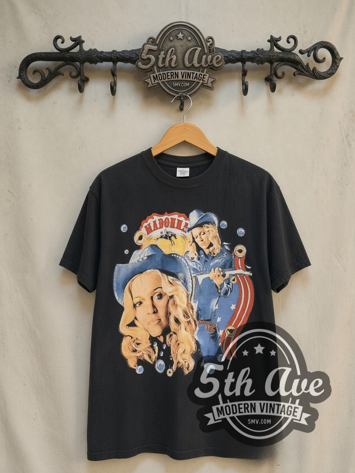 Madonna Music Album Cowboy Era vintage band t-shirt in black, front view on a display rack